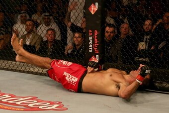 ABU DHABI, UNITED ARAB EMIRATES - APRIL 11:  Antonio Rodrigo Nogueira lays on the mat after being knocked out in the first round by Roy Nelson during their heavyweight bout during UFC Fight Night 39 at du Arena on April 11, 2014 in Abu Dhabi, United Arab 