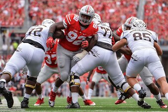 COLUMBUS, OH - SEPTEMBER 26:  Adolphus Washington #92 of the Ohio State Buckeyes breaks through the line against the Western Michigan Broncos at Ohio Stadium on September 26, 2015 in Columbus, Ohio.   (Photo by Jamie Sabau/Getty Images)