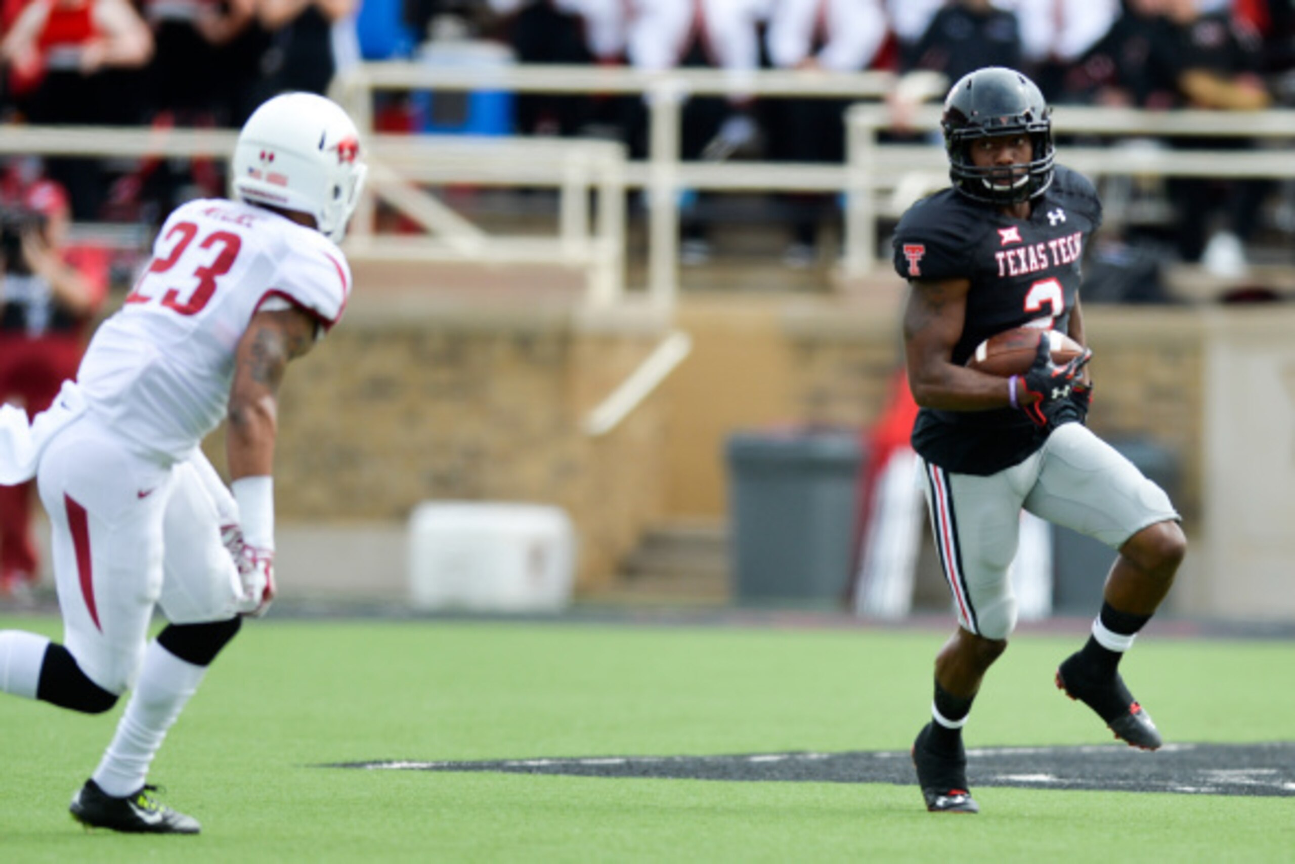 LUBBOCK, TX - SEPTEMBER 13: Reginald Davis #2 of the Texas Tech Red Raiders runs the ball against the Arkansas Razorbacks on September 13, 2014 at Jones AT&T Stadium in Lubbock, Texas. Arkansas defeated Texas Tech 49-28. (Photo by John Weast/Getty Images) LUBBOCK, TX - SEPTEMBER 13: Reginald Davis #2 of the Texas Tech Red Raiders runs the ball against the Arkansas Razorbacks on September 13, 2014 at Jones AT&T Stadium in Lubbock, Texas. Arkansas defeated Texas Tech 49-28. (Photo by John Weast/Getty Images)