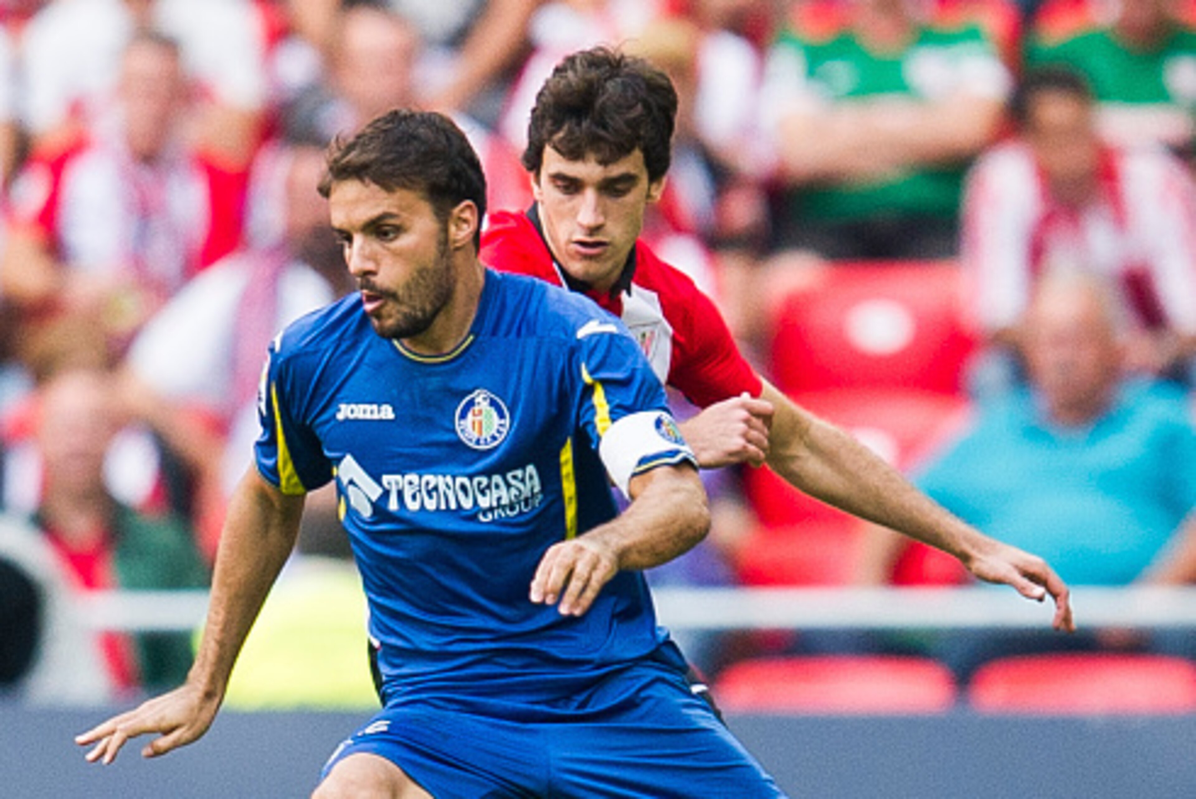 BILBAO, SPAIN - SEPTEMBER 13: Inigo Lekue of Athletic Club duels for the ball with Pedro Leon of Getafe CF during the La Liga match between Athletic Club and Getafe CF at San Mames Stadium on September 13, 2015 in Bilbao, Spain. (Photo by Juan Manuel Se BILBAO, SPAIN - SEPTEMBER 13: Inigo Lekue of Athletic Club duels for the ball with Pedro Leon of Getafe CF during the La Liga match between Athletic Club and Getafe CF at San Mames Stadium on September 13, 2015 in Bilbao, Spain. (Photo by Juan Manuel Se