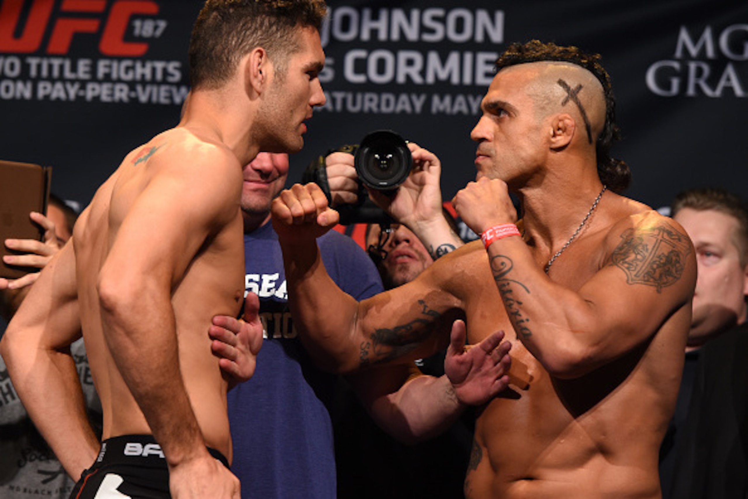 LAS VEGAS, NV - MAY 22:   (L-R) Chris Weidman and Vitor Belfort of Brazil face off during the UFC 187 weigh-in at the MGM Grand Conference Center on May 22, 2015 in Las Vegas, Nevada. (Photo by Josh Hedges/Zuffa LLC/Zuffa LLC via Getty Images)
