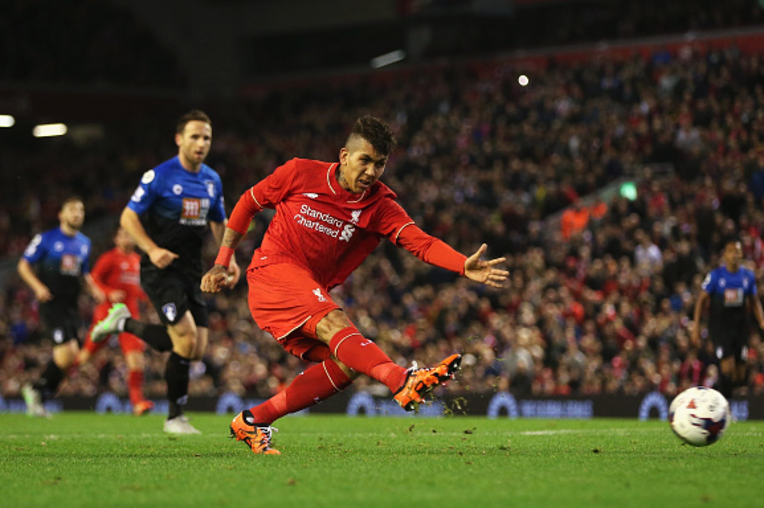 LIVERPOOL, ENGLAND - OCTOBER 28: Roberto Firmino of Liverpool shoots during the Capital One Cup Fourth Round match between Liverpool and AFC Bournemouth at Anfield on October 28, 2015 in Liverpool, England.  (Photo by Chris Brunskill/Getty Images)