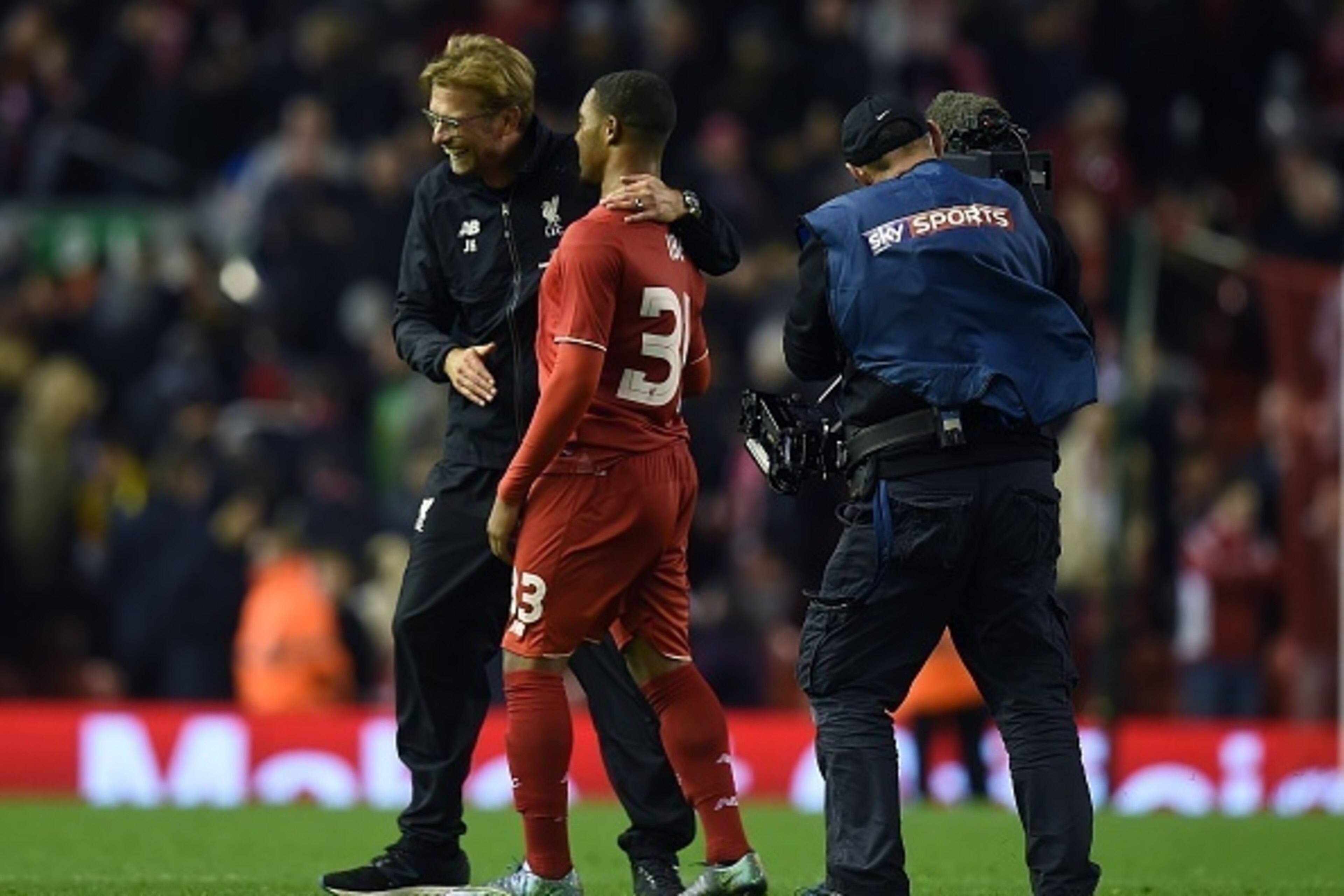 A television camera operator for European pay-TV broadcaster Sky's Sky Sports channel, (R) films Liverpool's German manager Jurgen Klopp (L) reacting with Liverpool's English midfielder Jordon Ibe following the English League Cup fourth round football mat A television camera operator for European pay-TV broadcaster Sky's Sky Sports channel, (R) films Liverpool's German manager Jurgen Klopp (L) reacting with Liverpool's English midfielder Jordon Ibe following the English League Cup fourth round football mat