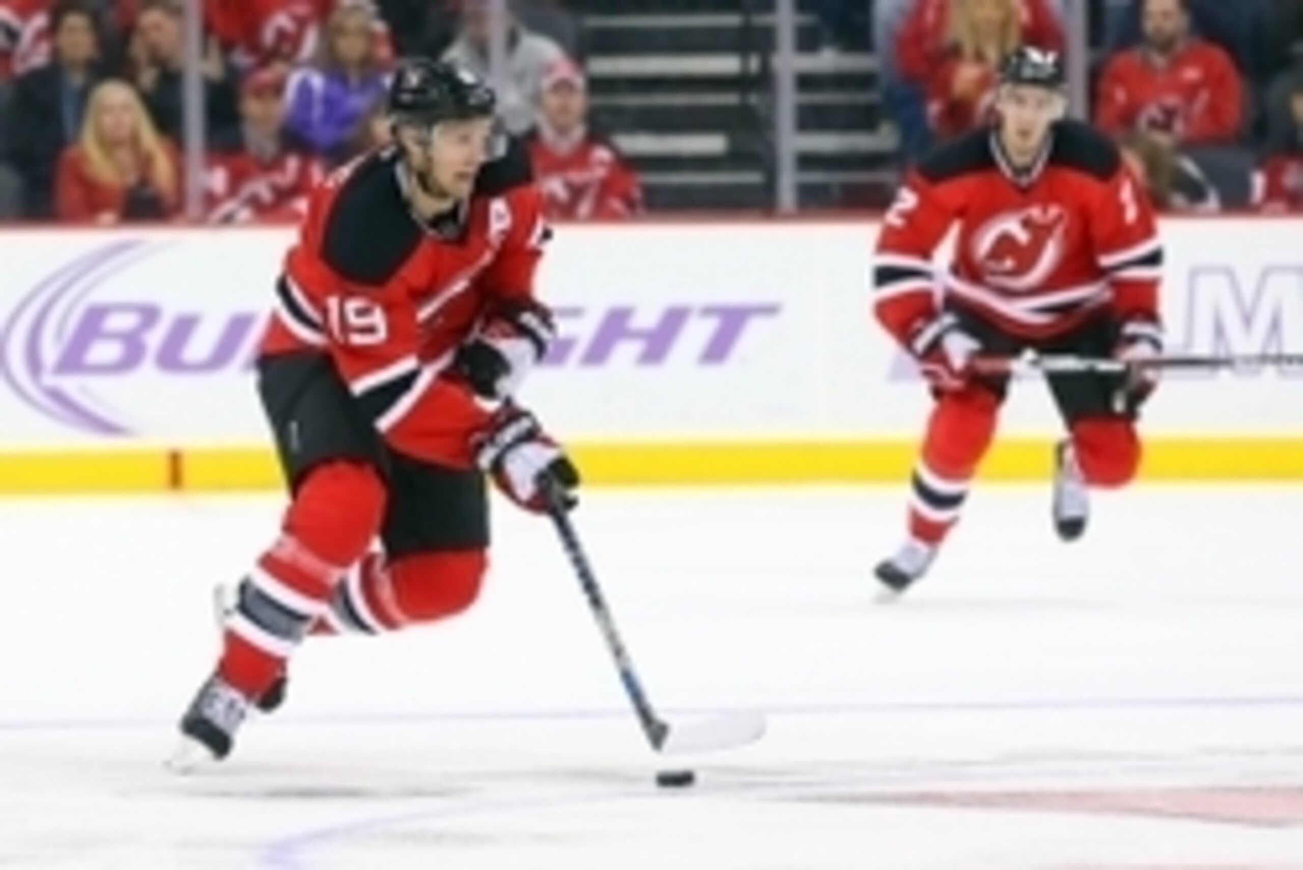 Oct 27, 2015; Newark, NJ, USA; New Jersey Devils center Travis Zajac (19) skates with the puck during the third period at Prudential Center. The Blue Jackets defeated the Devils 3-1.  Mandatory Credit: Ed Mulholland-USA TODAY Sports