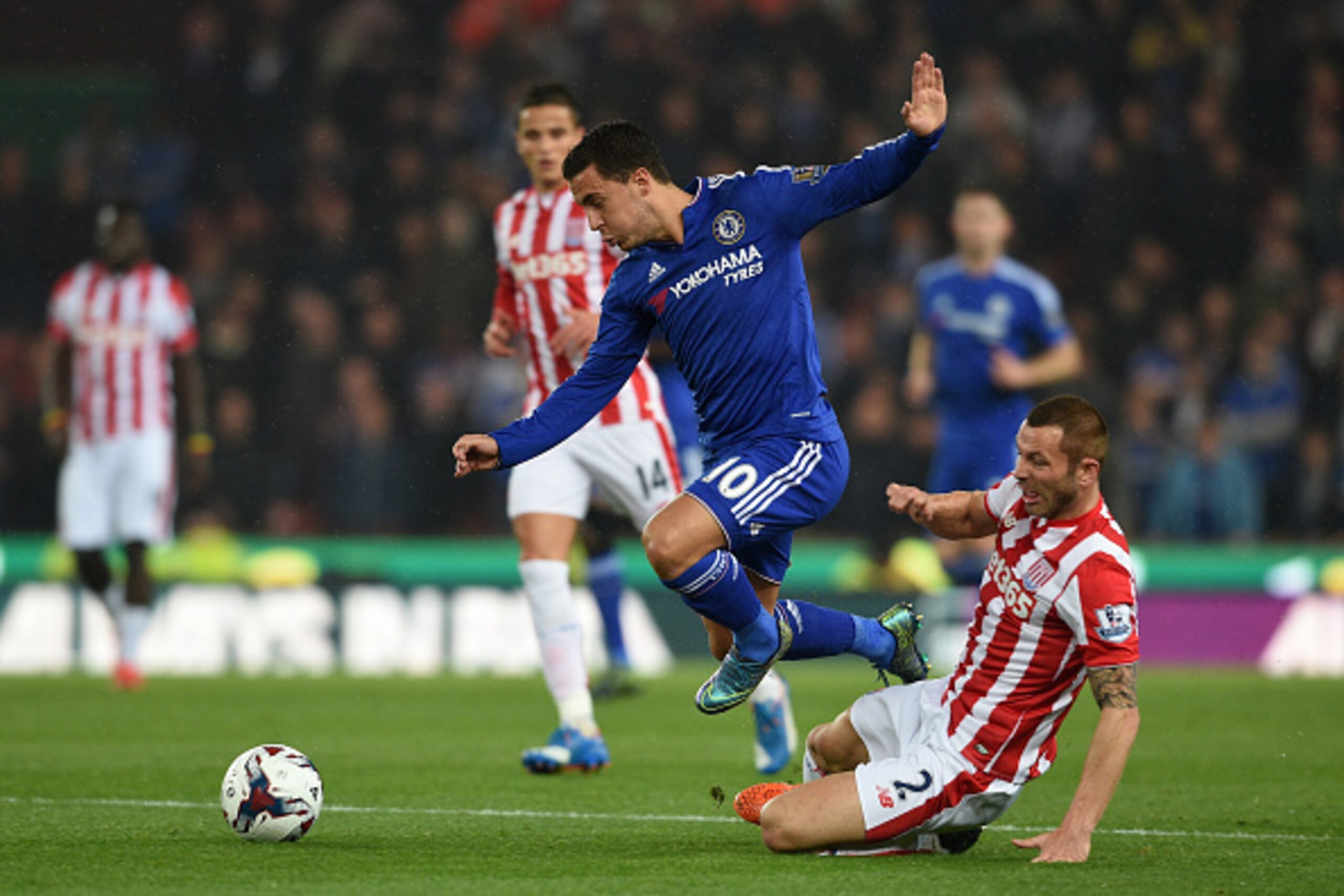 STOKE ON TRENT, ENGLAND - OCTOBER 27: Eden Hazard of Chelsea hurdles the challenge from Phillip Bardsley of Stoke City during the Capital One Cup fourth round match between Stoke City and Chelsea at the Britannia Stadium on October 27, 2015 in Stoke on T STOKE ON TRENT, ENGLAND - OCTOBER 27: Eden Hazard of Chelsea hurdles the challenge from Phillip Bardsley of Stoke City during the Capital One Cup fourth round match between Stoke City and Chelsea at the Britannia Stadium on October 27, 2015 in Stoke on T