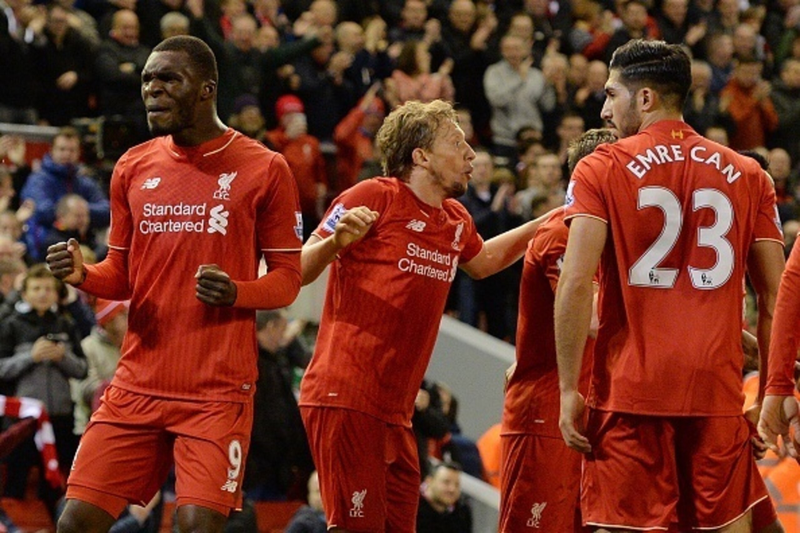Liverpool's Zaire-born Belgian striker Christian Benteke (L) celebrates with Liverpool players after scoring the opening goal of the English Premier League football match between Liverpool and Southampton at Anfield stadium in Liverpool, north west Englan