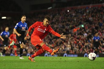 LIVERPOOL, ENGLAND - OCTOBER 28: Roberto Firmino of Liverpool shoots during the Capital One Cup Fourth Round match between Liverpool and AFC Bournemouth at Anfield on October 28, 2015 in Liverpool, England.  (Photo by Chris Brunskill/Getty Images)