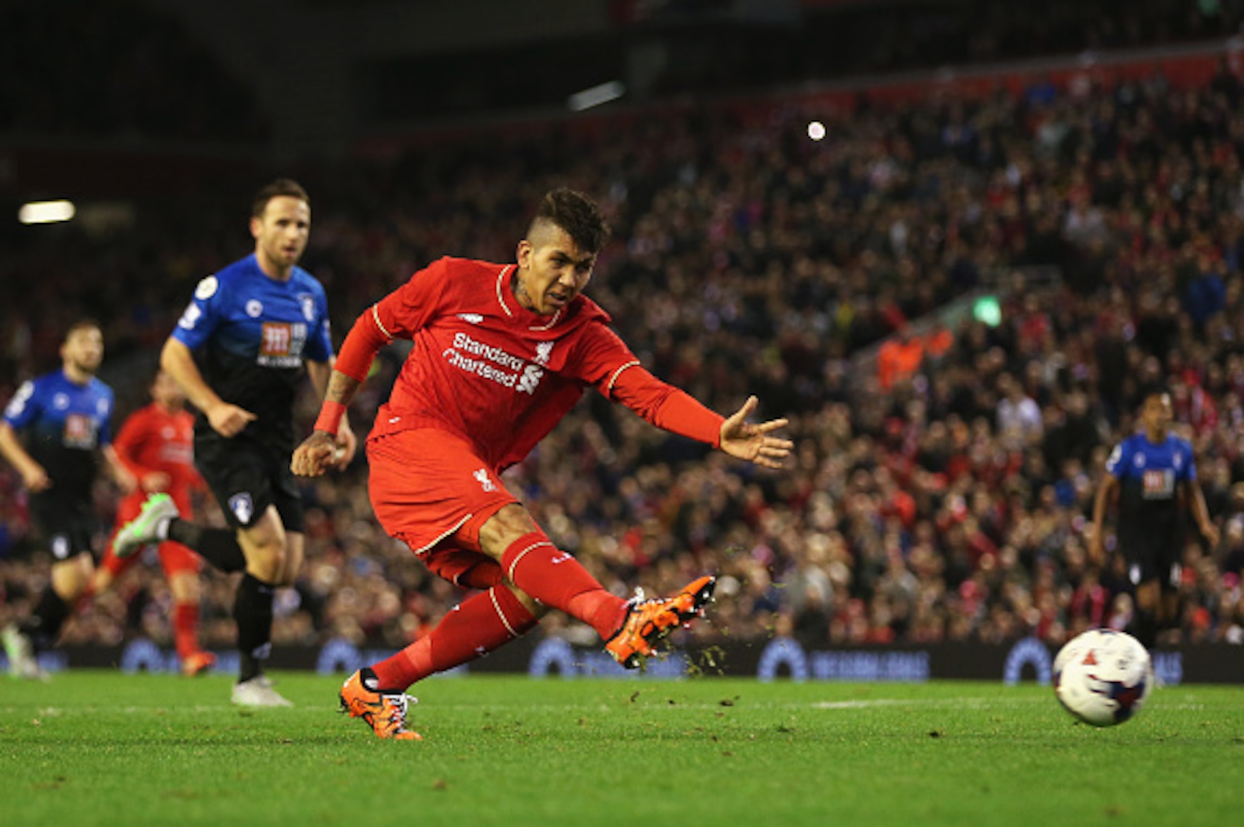 LIVERPOOL, ENGLAND - OCTOBER 28: Roberto Firmino of Liverpool shoots during the Capital One Cup Fourth Round match between Liverpool and AFC Bournemouth at Anfield on October 28, 2015 in Liverpool, England.  (Photo by Chris Brunskill/Getty Images)