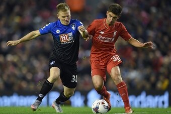 Bournemouth's English midfielder Matt Ritchie (L) vies against Liverpool's English midfielder Cameron Brannagan during the English League Cup fourth round football match between Liverpool and Bournemouth at Anfield stadium in Liverpool, north west England