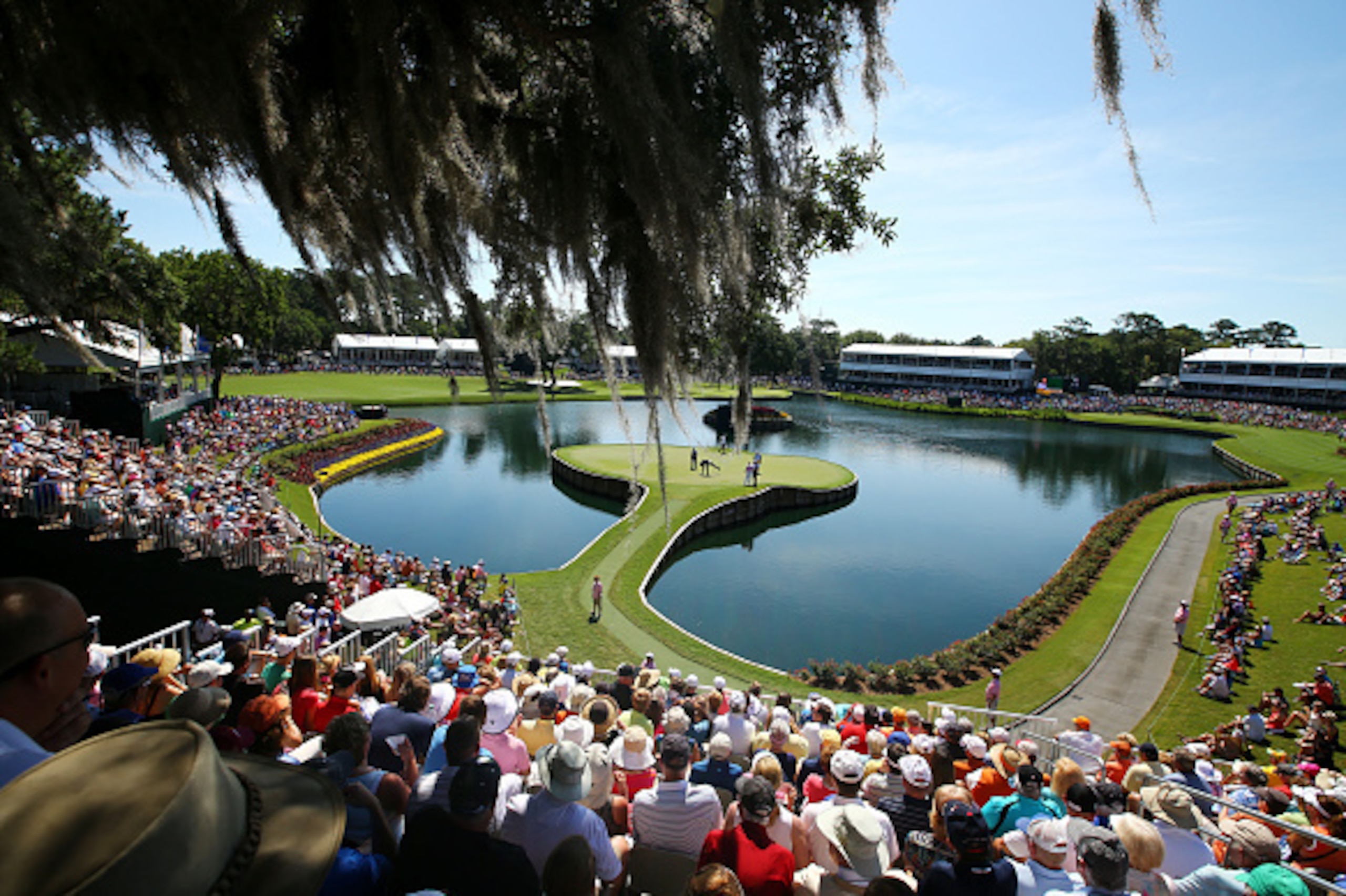 PONTE VEDRA BEACH, FL - MAY 08:  A general view of the 17th green as Phil Mickelson, Sergio Garcia of Spain and K.J. Choi of South Korea putt during round two of THE PLAYERS Championship at the TPC Sawgrass Stadium course on May 8, 2015 in Ponte Vedra Bea