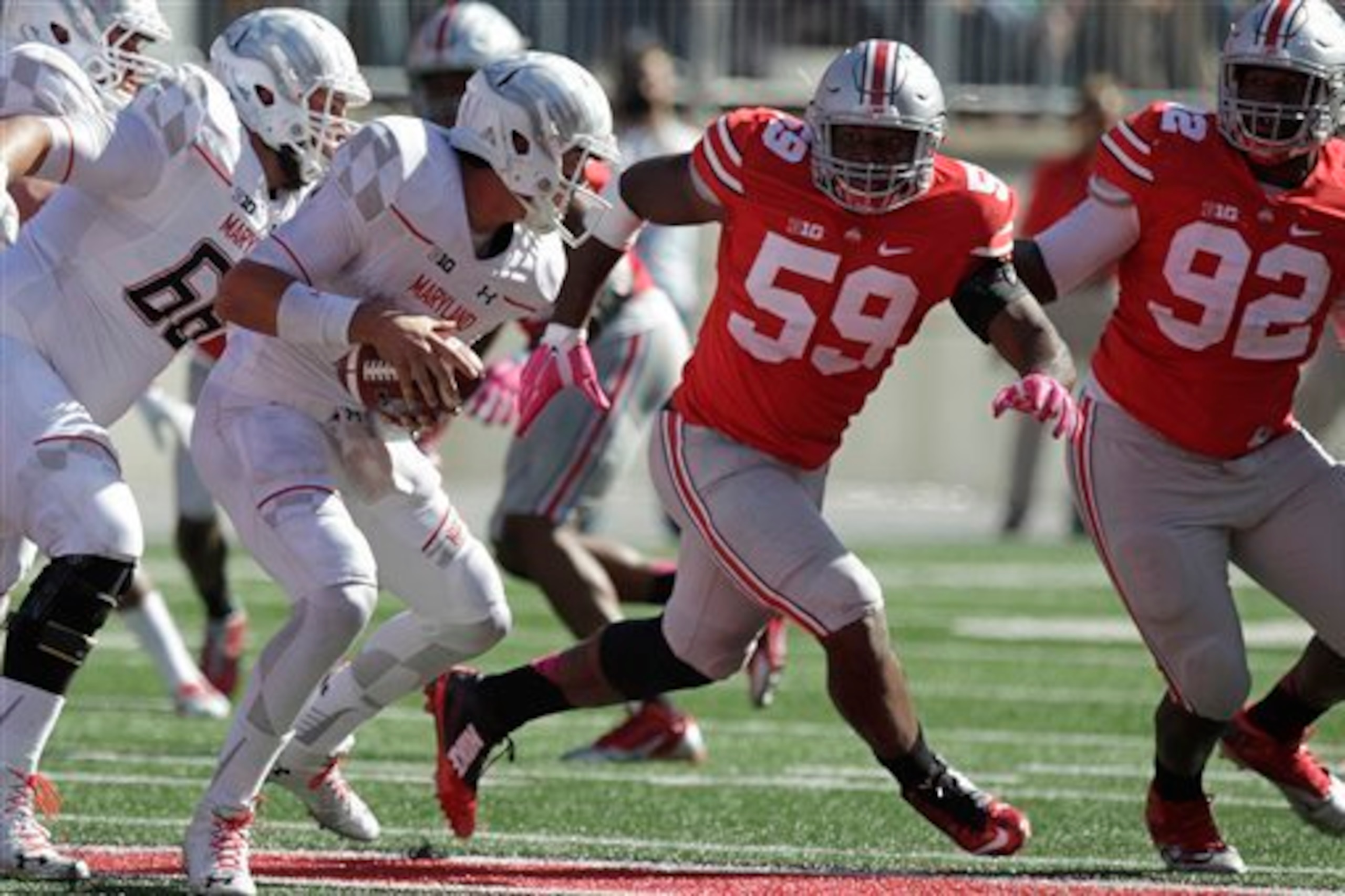 Tyquan Lewis (59) and Adolphus Washington (92)