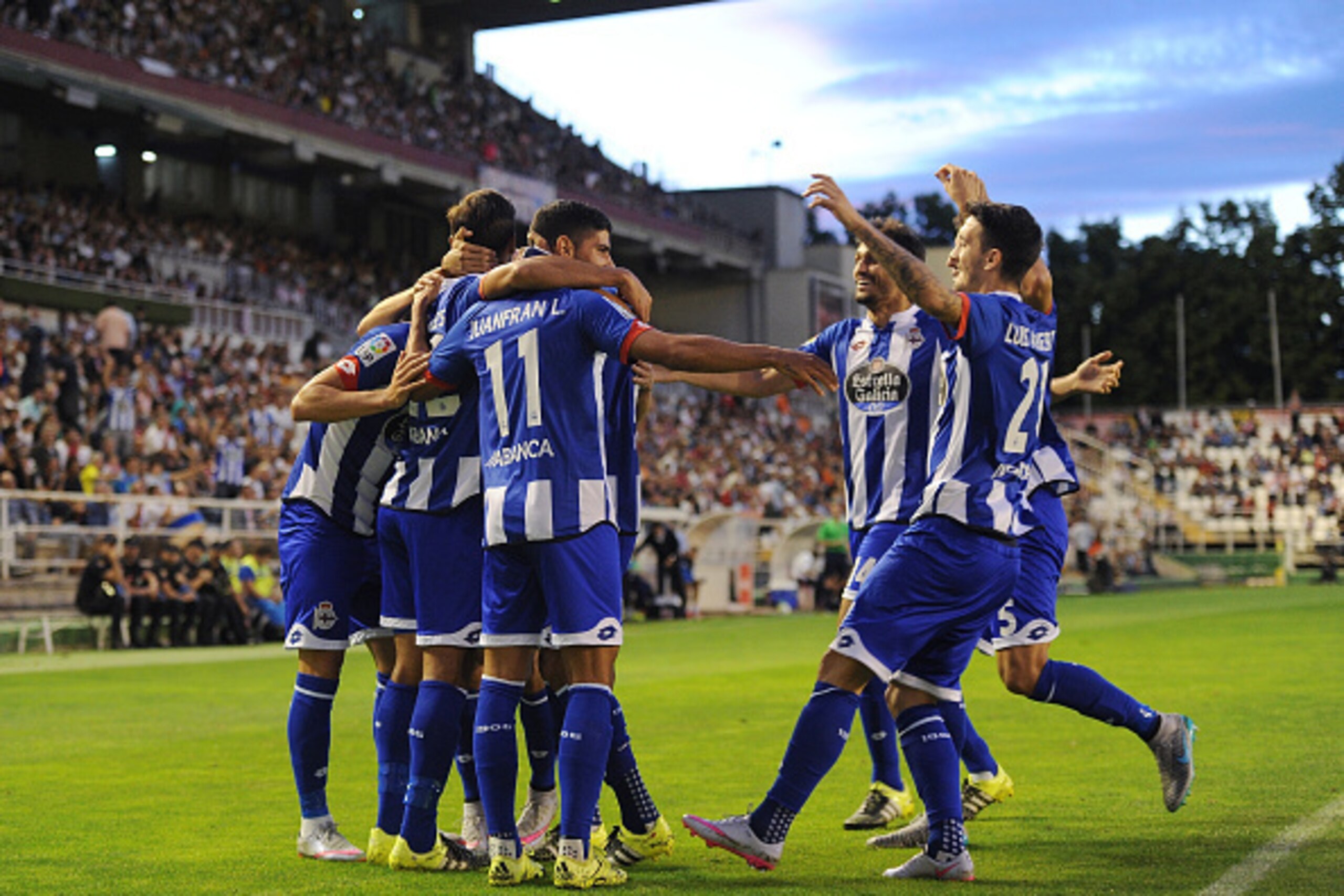 MADRID, SPAIN - SEPTEMBER 14:  Juanfran of RC Deportivo la Coruna celebrates with teammates after Carlos Borges scored their opening goal during the La Liga match between Rayo Vallecano and RC Deportivo La Coruna at Estadio Teresa Rivero on September 14, 