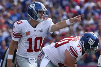 ORCHARD PARK, NY - OCTOBER 4: Eli Manning #10 of the New York Giants calls a play before receiving the snap from Weston Richburg #70 during NFL game action against the Buffalo Bills at Ralph Wilson Stadium on October 4, 2015 in Orchard Park, New York. (Ph