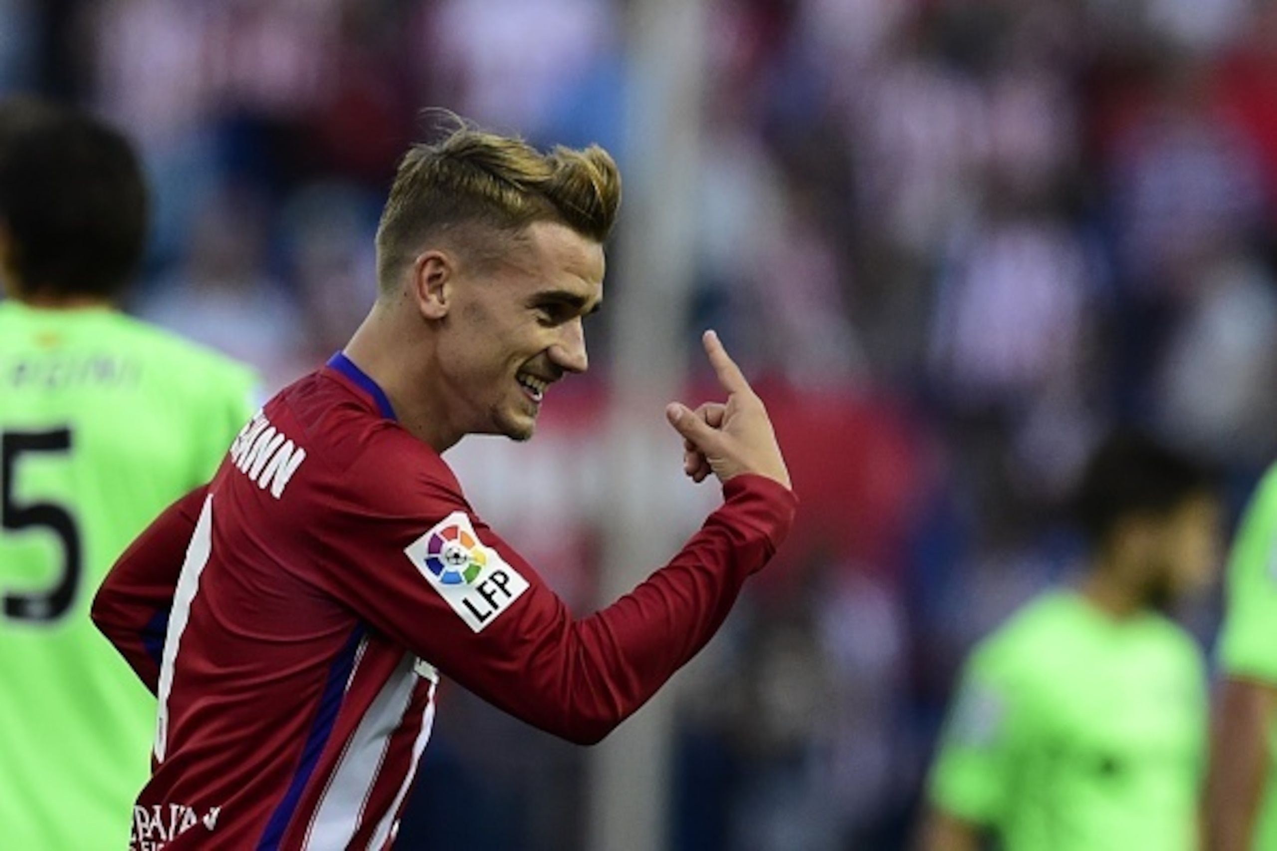 Atletico Madrid's French forward Antoine Griezmann celebrates after scoring a goal during the Spanish league football match Club Atletico de Madrid vs Getafe CF at the Vicente Calderon stadium in Madrid on September 22, 2015. AFP PHOTO/ JAVIER SORIANO Atletico Madrid's French forward Antoine Griezmann celebrates after scoring a goal during the Spanish league football match Club Atletico de Madrid vs Getafe CF at the Vicente Calderon stadium in Madrid on September 22, 2015. AFP PHOTO/ JAVIER SORIANO