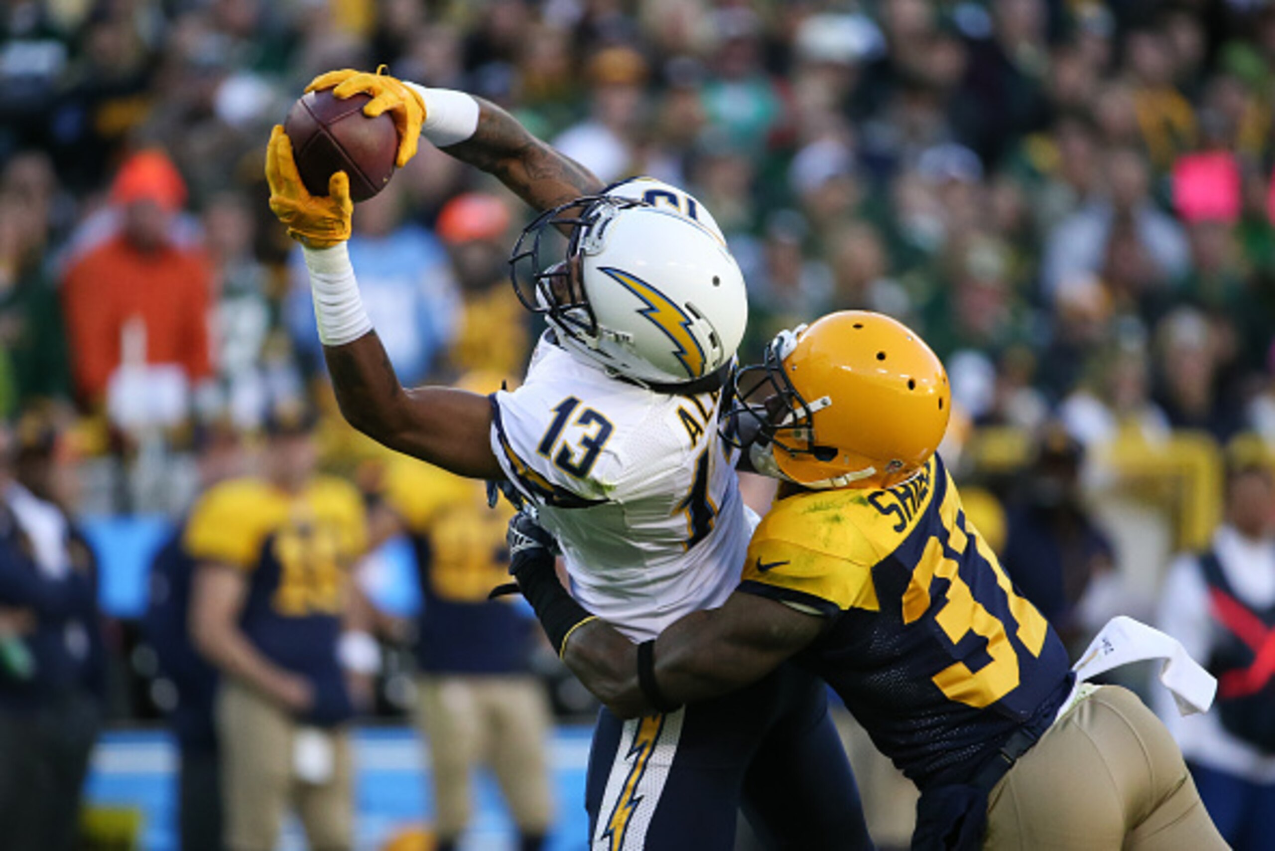 GREEN BAY, WI - OCTOBER 18:  Keenan Allen #13 of the San Diego Chargers makes a catch for a first down against  Sam Shields #37 of the Green Bay Packers in the second quarter at Lambeau Field on October 18, 2015 in Green Bay, Wisconsin.  (Photo by Jonatha