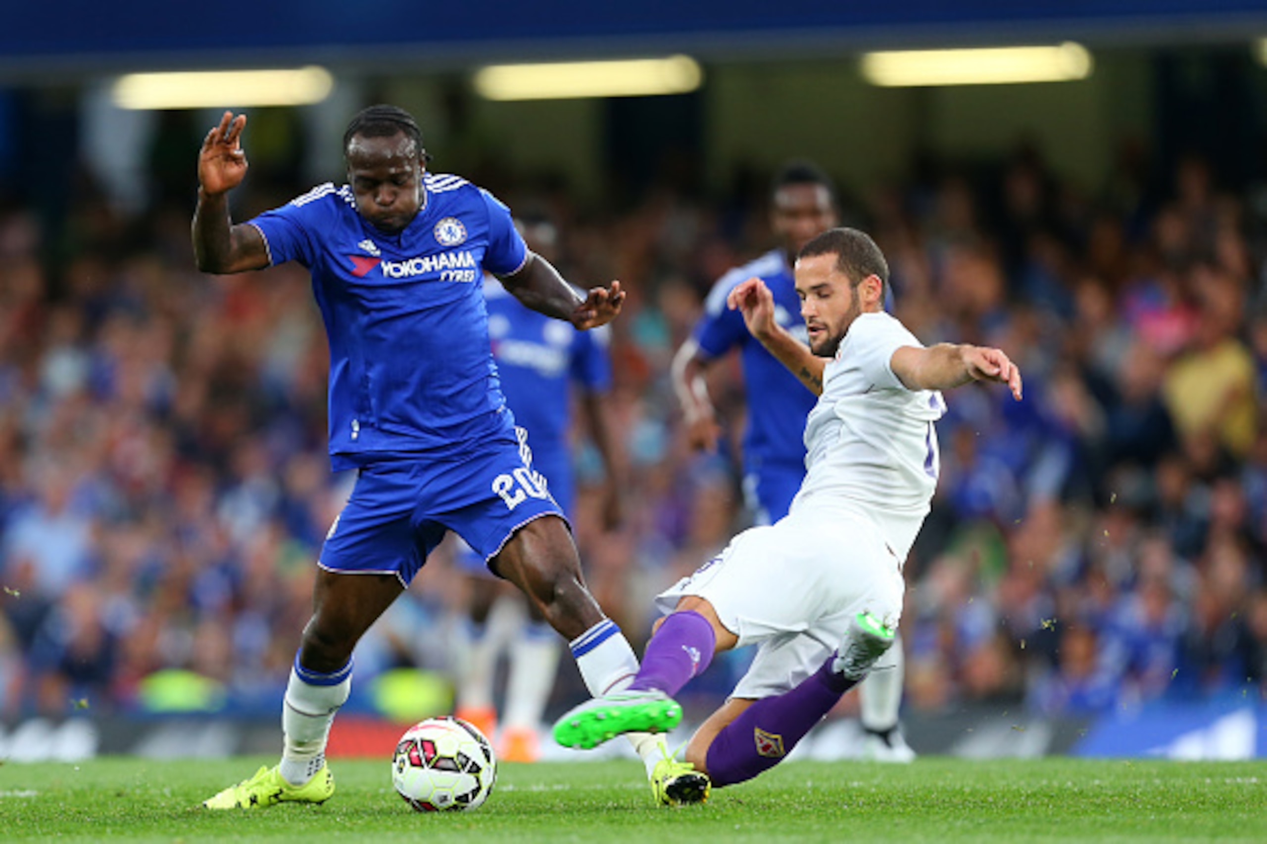 LONDON, ENGLAND - AUGUST 03:  Victor Moses of Chelsea is tackled by Mario Suarez of Fiorentina during the pre-season friendly between Chelsea and Fiorentina at Stamford Bridge on August 5, 2015 in London, England.  (Photo by Catherine Ivill - AMA/Getty Im
