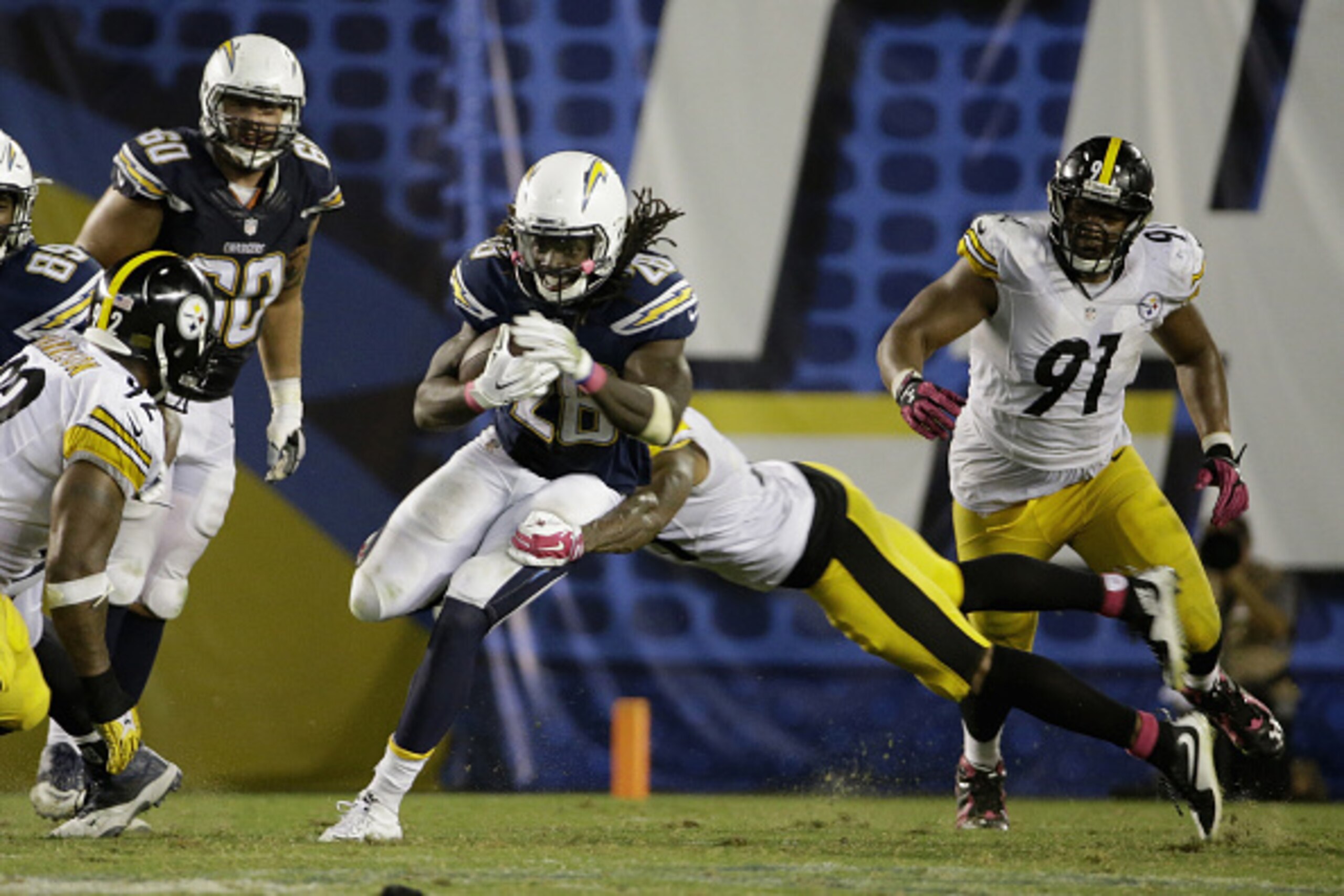 SAN DIEGO, CA - OCTOBER 12:  Running back Melvin Gordon #28 of the San Diego Chargers is tackled by defensive back Ross Cockrell #31 of the Pittsburgh Steelers at Qualcomm Stadium on October 12, 2015 in San Diego, California.  (Photo by Jeff Gross/Getty I