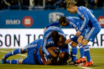 Oct 29, 2015; Montreal, Quebec, CAN; Montreal Impact midfielder Ignacio Piatti (10) reacts with teammates including Didier Drogba (11) and Nigel Reo-Coker (14) after scoring a goal against the Toronto FC during the first half of a knockout round match of
