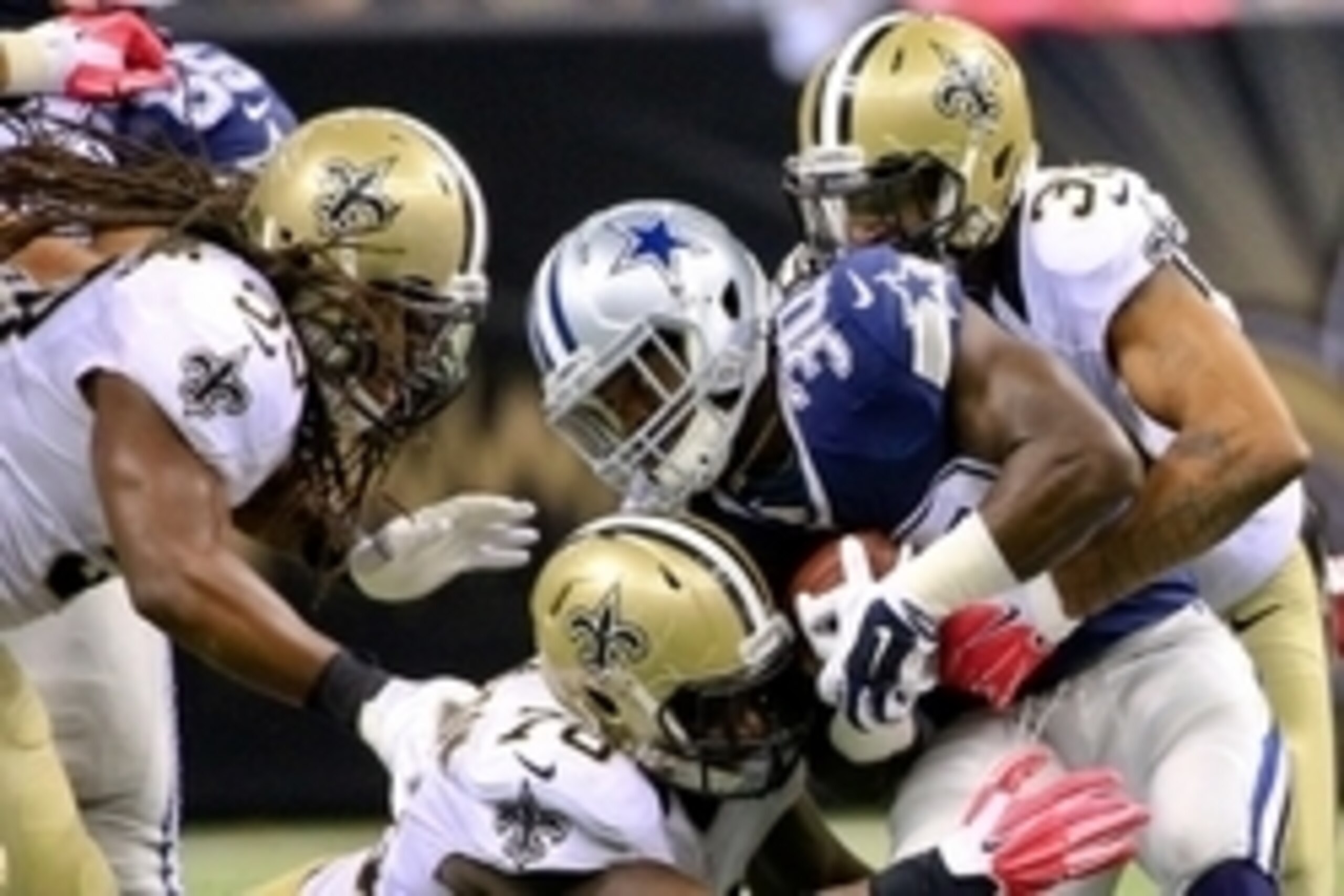 Oct 4, 2015; New Orleans, LA, USA; New Orleans Saints cornerback Brandon Browner (39) and defensive end Bobby Richardson (78) tackle Dallas Cowboys running back Christine Michael (30) during the fourth quarter at the Mercedes-Benz Superdome. The Saints wo