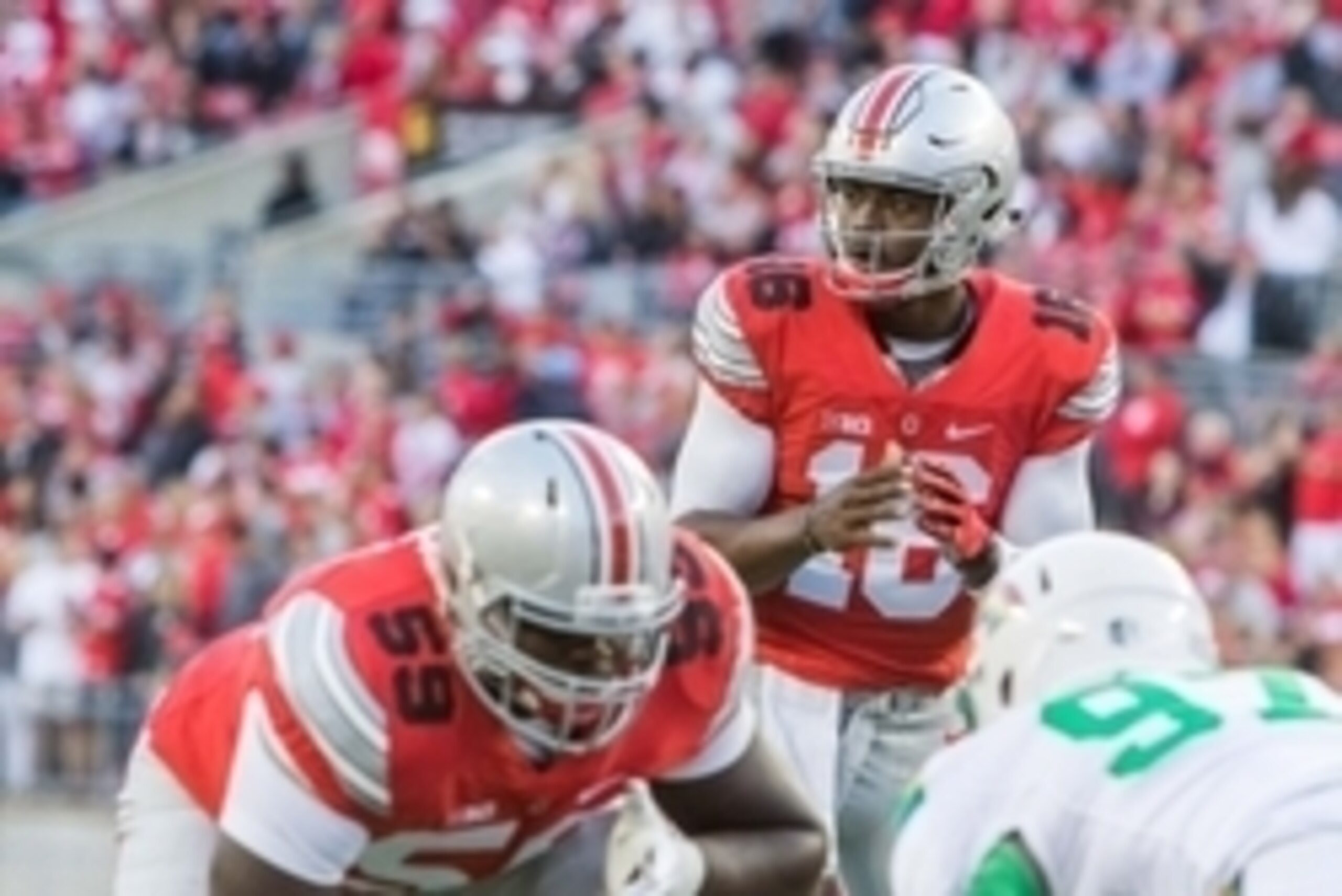Sep 12, 2015; Columbus, OH, USA; Ohio State Buckeyes quarterback J.T. Barrett (16) before the snap of the ball during the game against the Hawaii Warriors at Ohio Stadium. The Ohio State Buckeyes beat the Hawaii Warriors by the score of 38-0. Mandatory Cr