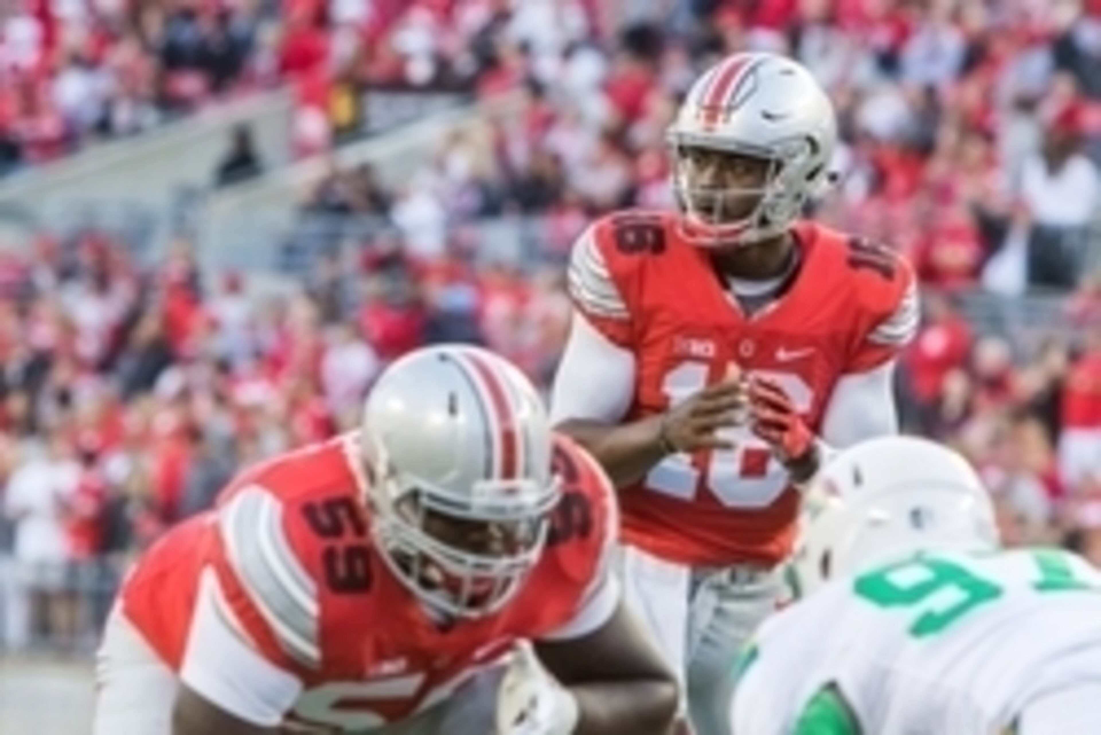 Sep 12, 2015; Columbus, OH, USA; Ohio State Buckeyes quarterback J.T. Barrett (16) before the snap of the ball during the game against the Hawaii Warriors at Ohio Stadium. The Ohio State Buckeyes beat the Hawaii Warriors by the score of 38-0. Mandatory Cr
