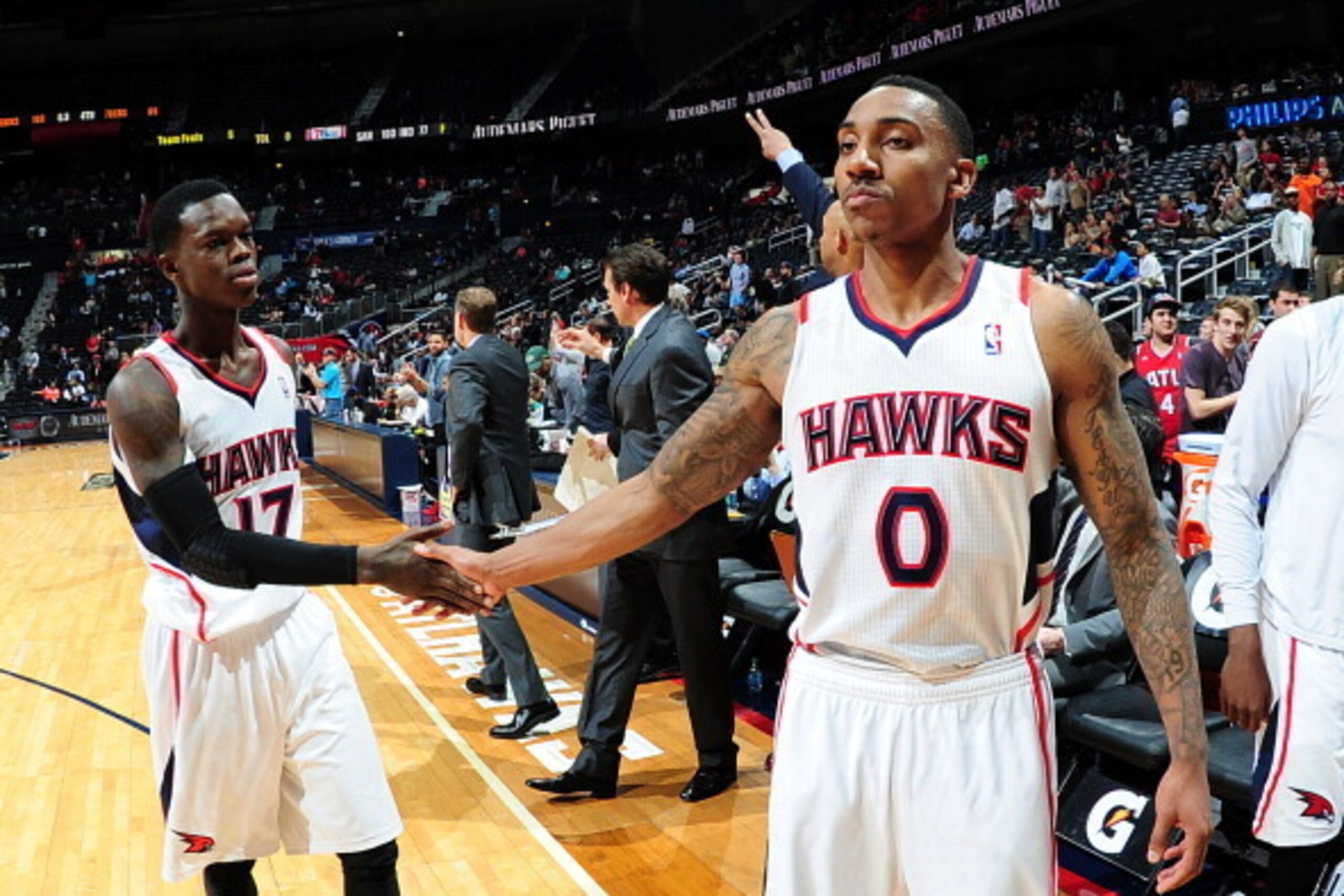 ATLANTA, GA - MARCH 31: Dennis Schroder #17 and Jeff Teague #0 of the Atlanta Hawks celebrate after the game against the Philadelphia 76ers on March 31, 2014 at Philips Arena in Atlanta, Georgia.  NOTE TO USER: User expressly acknowledges and agrees that,