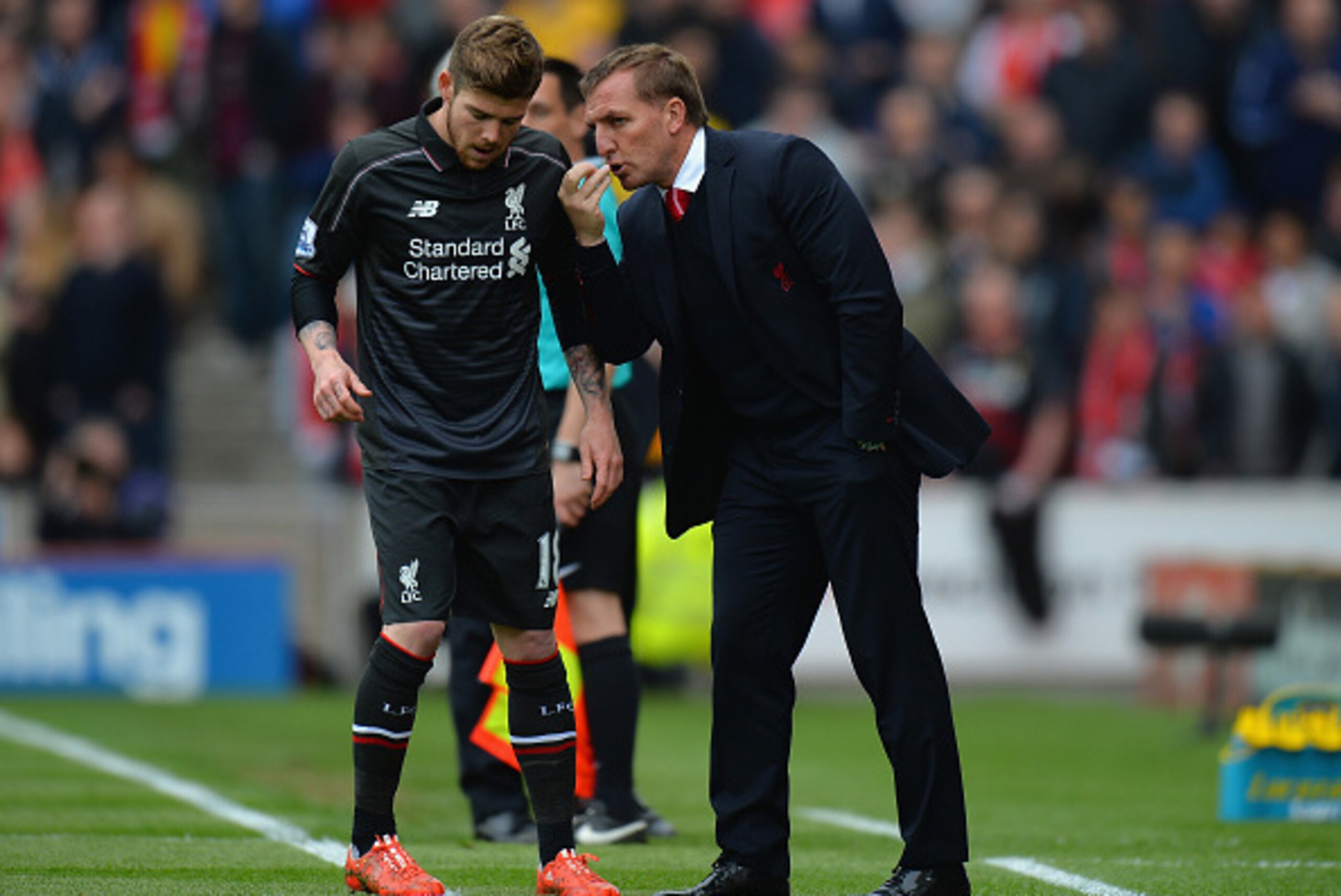 STOKE ON TRENT, ENGLAND - MAY 24:  Brendan Rodgers, Manager of Liverpool talks to Alberto Moreno of Liverpool on the touch line during the Barclays Premier League match between Stoke City and Liverpool at Britannia Stadium on May 24, 2015 in Stoke on Tren