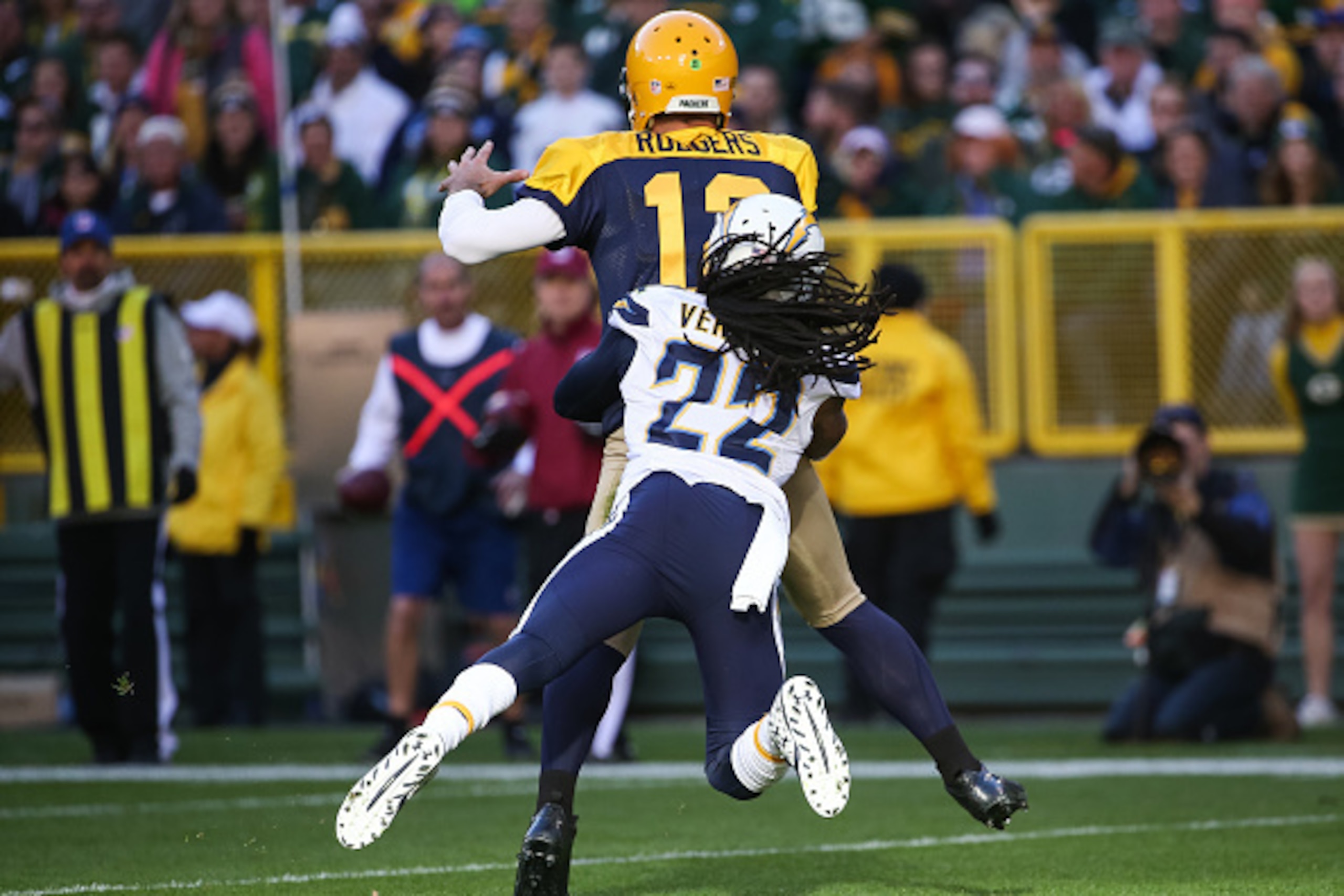 GREEN BAY, WI - OCTOBER 18: Quarterback Aaron Rodgers #12 of the Green Bay Packers is hit by Jason Verrett #22 of the San Diego Chargers in the first quarter at Lambeau Field on October 18, 2015 in Green Bay, Wisconsin. (Photo by Jonathan Daniel/Getty Ima GREEN BAY, WI - OCTOBER 18: Quarterback Aaron Rodgers #12 of the Green Bay Packers is hit by Jason Verrett #22 of the San Diego Chargers in the first quarter at Lambeau Field on October 18, 2015 in Green Bay, Wisconsin. (Photo by Jonathan Daniel/Getty Ima