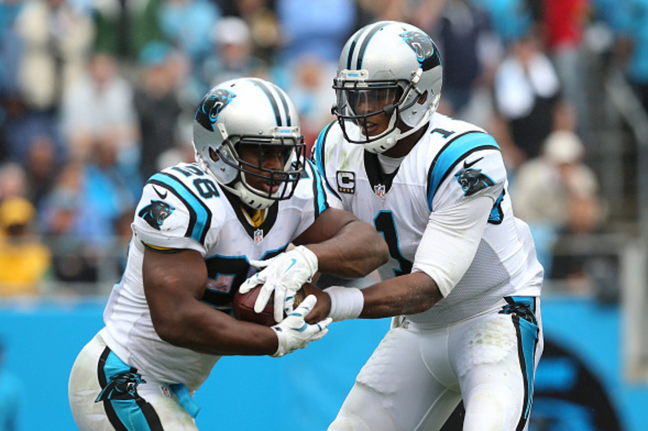 CHARLOTTE, NC - SEPTEMBER 27:   Cam Newton #1 of the Carolina Panthers and  Jonathan Stewart #28 of the Carolina Panthers during their game at Bank of America Stadium on September 27, 2015 in Charlotte, North Carolina.  (Photo by Streeter Lecka/Getty Imag