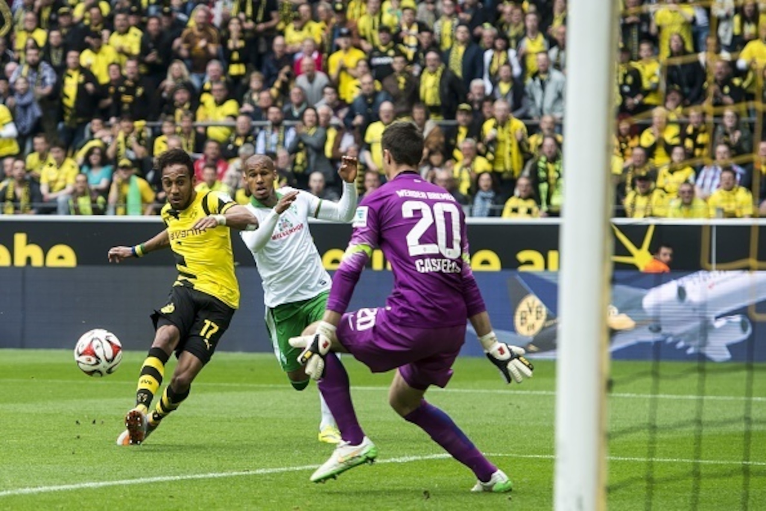 (L-R) Pierre-Emerick Aubameyang of Borussia Dortmund, Theodor Gebre Selassie of Werder Bremen, goalkeeper Koen Casteels of Werder Bremen during the Bundesliga match between Borussia Dortmund and Werder Bremen on May 23, 2015 at the Signal Iduna Park in Do
