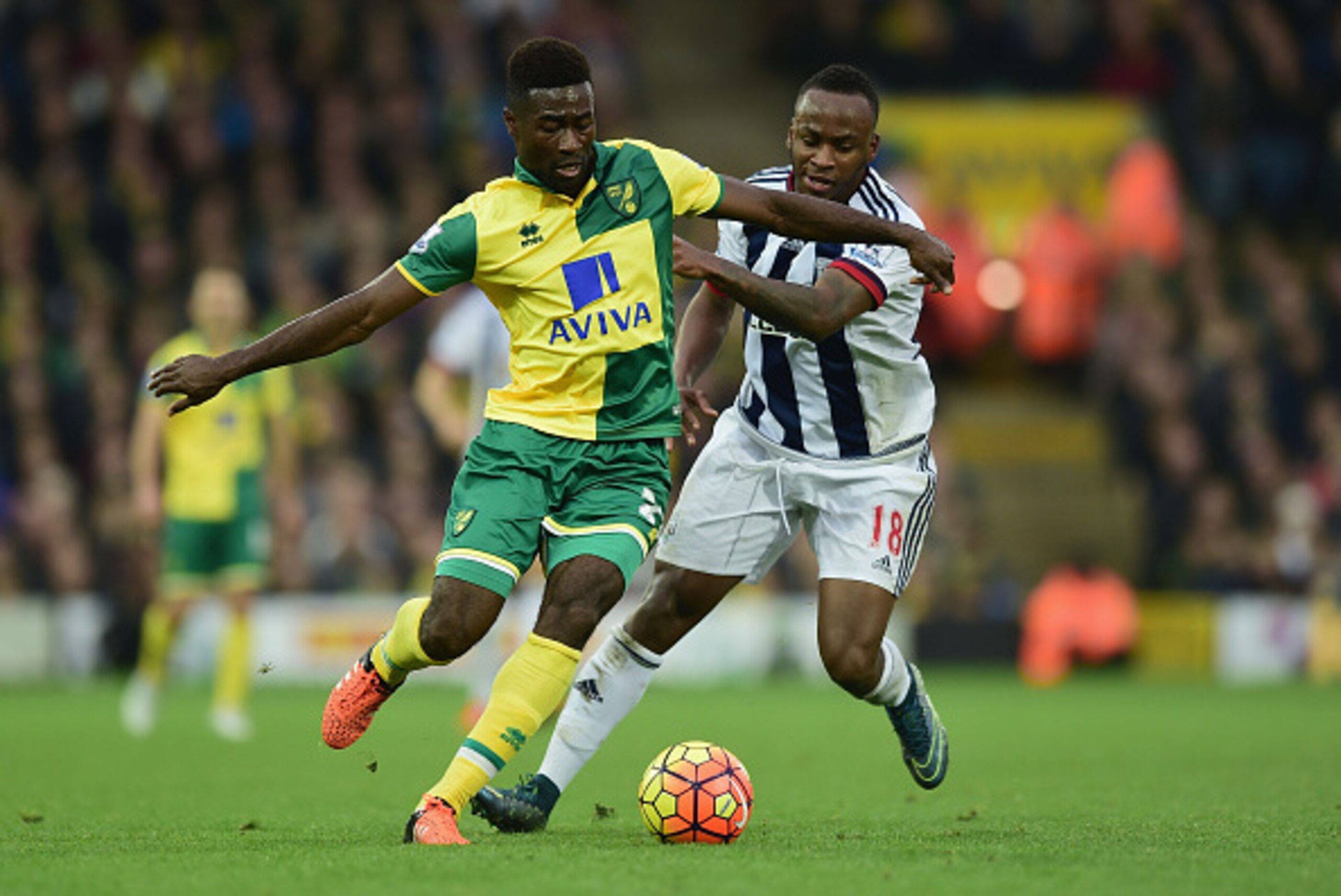 NORWICH, ENGLAND - OCTOBER 24: Alexander Tettey of Norwich City and Saido Berahino of West Bromwich Albion compete for the ball during the Barclays Premier League match between Norwich City and West Bromwich Albion at Carrow Road on October 24, 2015 in No NORWICH, ENGLAND - OCTOBER 24: Alexander Tettey of Norwich City and Saido Berahino of West Bromwich Albion compete for the ball during the Barclays Premier League match between Norwich City and West Bromwich Albion at Carrow Road on October 24, 2015 in No