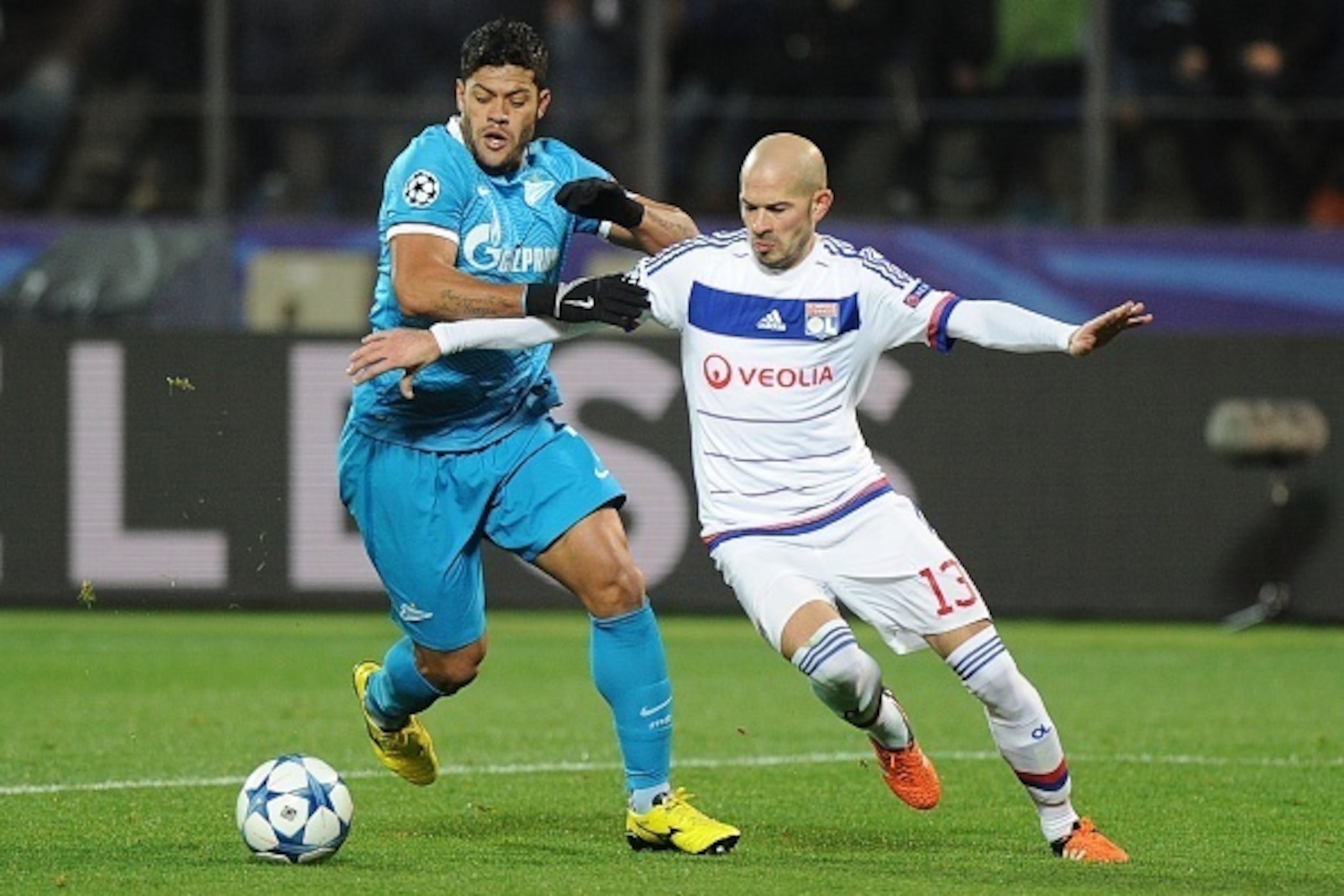 Zenit's Brazilian forward Hulk (L) vies for the ball with Lyon's French defender Christophe Jallet during the UEFA Champions League group H football match between FC Zenit and Olympique Lyonnais at the Petrovsky stadium in St. Petersburg on October 20, 20