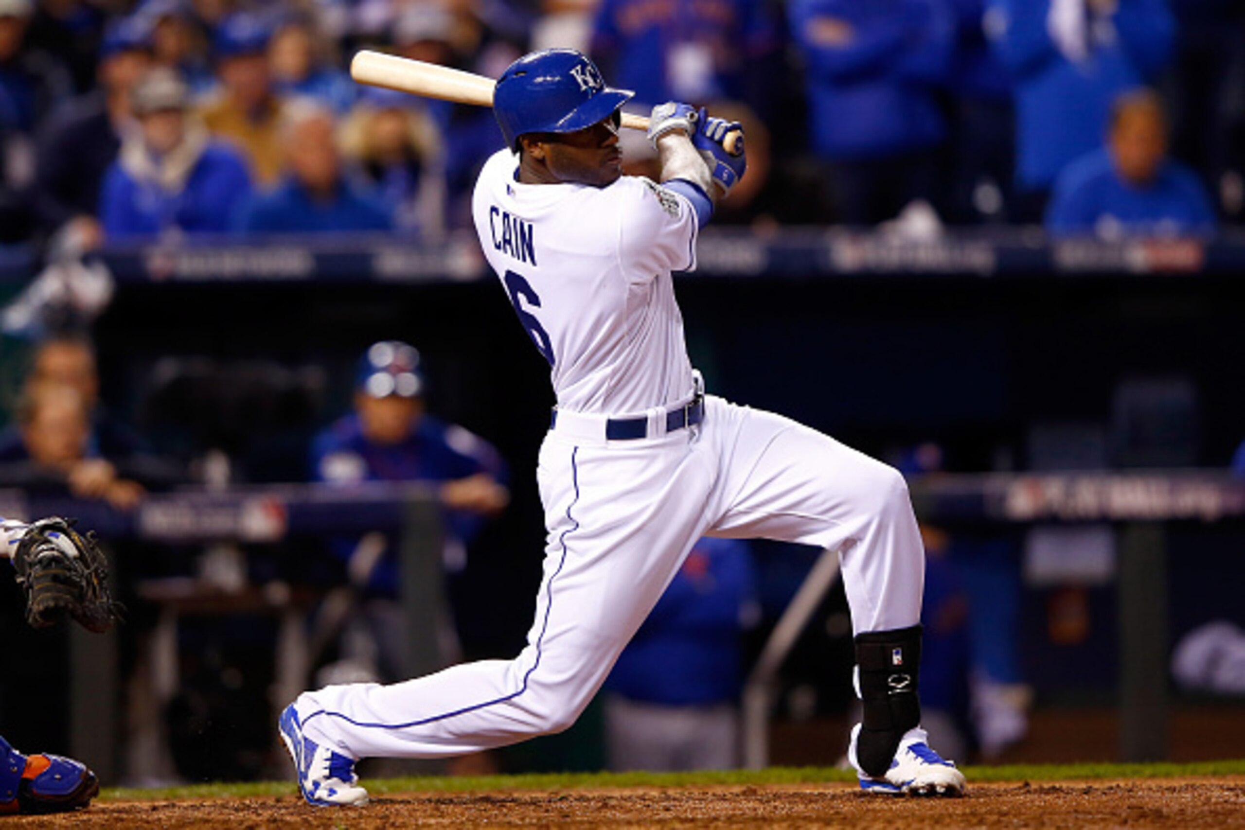 KANSAS CITY, MO - OCTOBER 27:  Lorenzo Cain #6 of the Kansas City Royals hits a single in the sixth inning against the New York Mets during Game One of the 2015 World Series at Kauffman Stadium on October 27, 2015 in Kansas City, Missouri.  (Photo by Jami