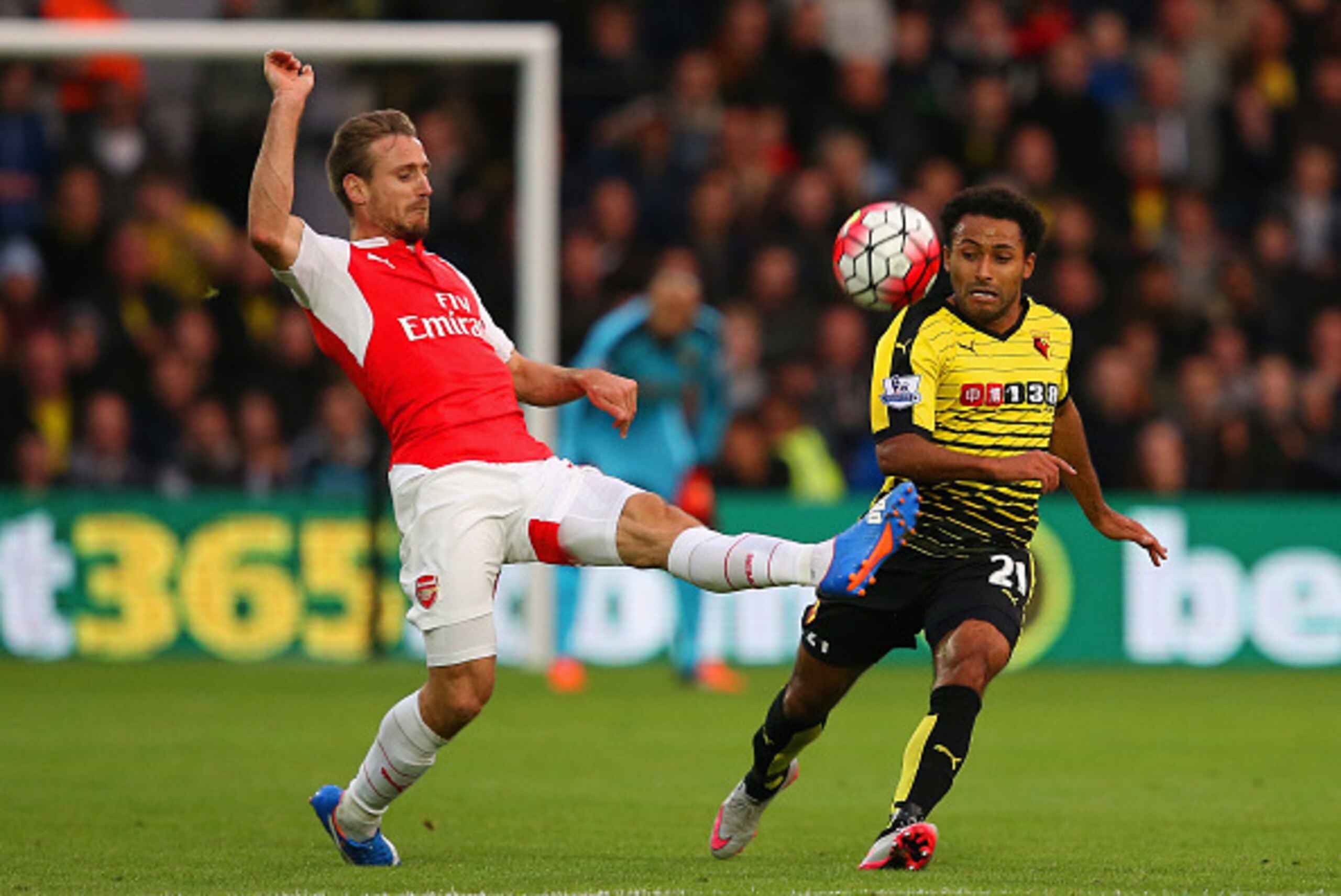 WATFORD, ENGLAND - OCTOBER 17: Nacho Monreal of Arsenal and Ikechi Anya of Watford compete for the ball during the Barclays Premier League match between Watford and Arsenal at Vicarage Road on October 17, 2015 in Watford, England. (Photo by Jan Kruger/G WATFORD, ENGLAND - OCTOBER 17: Nacho Monreal of Arsenal and Ikechi Anya of Watford compete for the ball during the Barclays Premier League match between Watford and Arsenal at Vicarage Road on October 17, 2015 in Watford, England. (Photo by Jan Kruger/G