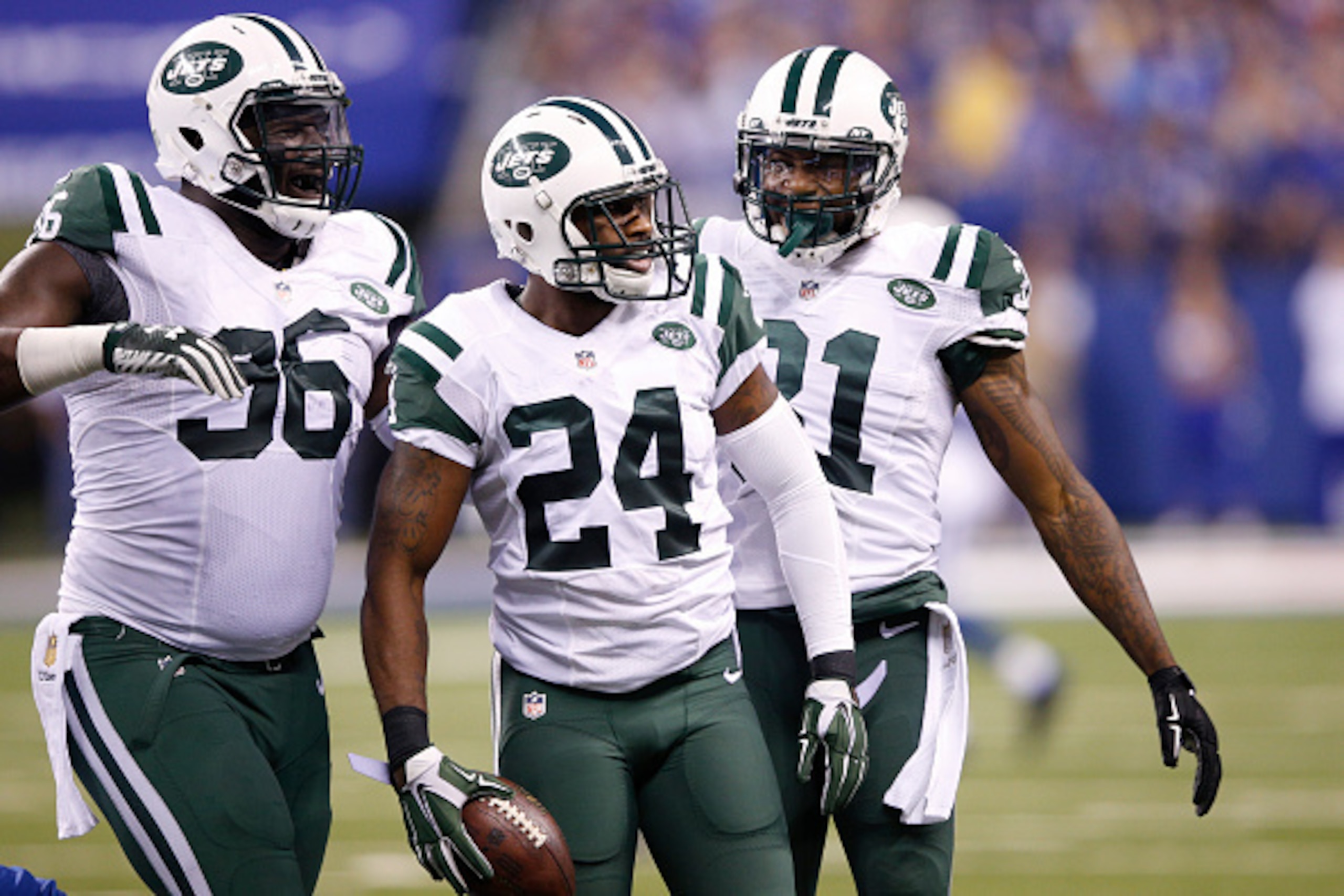 INDIANAPOLIS, IN - SEPTEMBER 21: Darrelle Revis #24 of the New York Jets celebrates with teammates after recovering a fumble against the Indianapolis Colts during the game at Lucas Oil Stadium on September 21, 2015 in Indianapolis, Indiana. The Jets defea