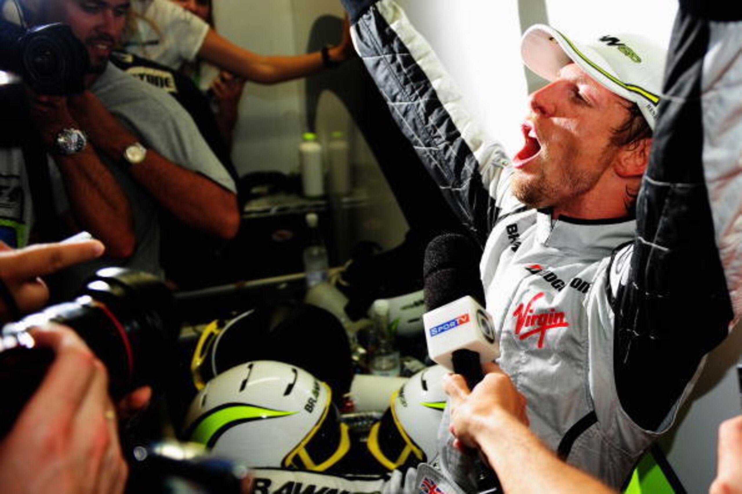 SAO PAULO, BRAZIL - OCTOBER 18:  Jenson Button of Great Britain and Brawn GP celebrates in hiis team garage after clinching the F1 World Drivers Championship during the Brazilian Formula One Grand Prix at the Interlagos Circuit on October 18, 2009 in Sao 