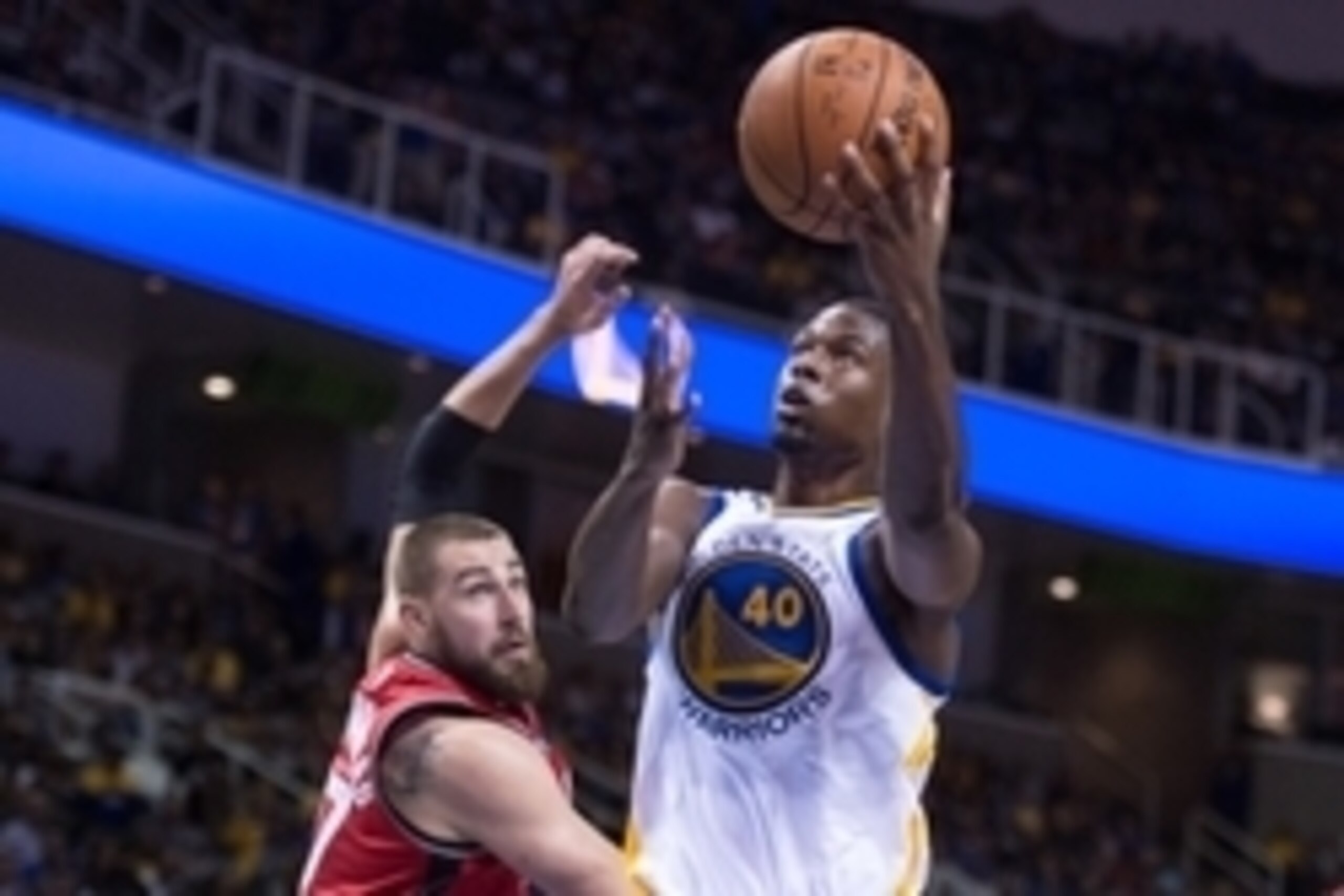October 5, 2015; San Jose, CA, USA; Golden State Warriors forward Harrison Barnes (40) shoots the basketball against Toronto Raptors center Jonas Valanciunas (17) during the third quarter in a preseason game at SAP Center. The Warriors defeated the Raptor