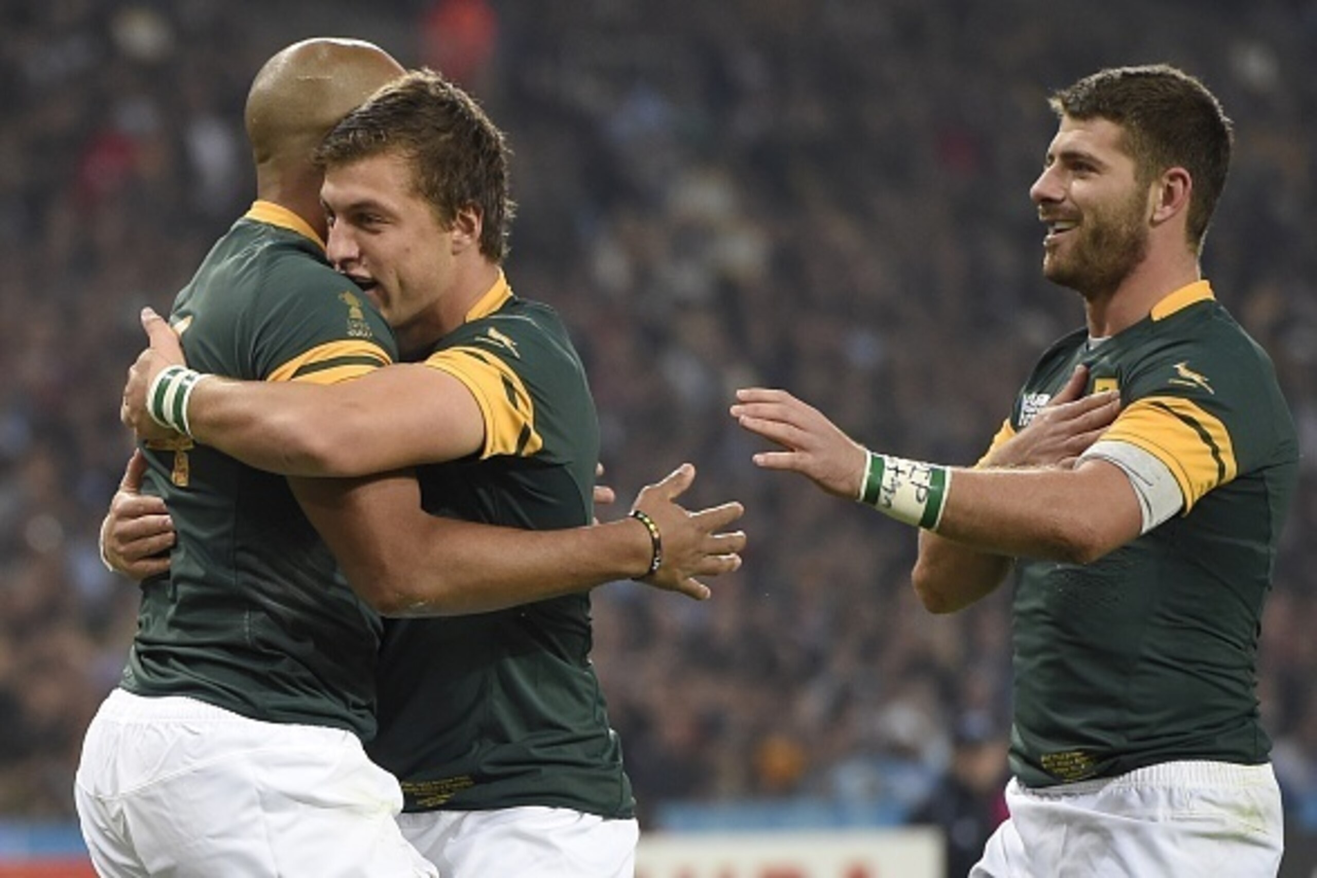 South Africa's wing JP Pietersen (L) celebrates with South Africa's fly half Handre Pollard after scoring a try during the bronze medal match of the 2015 Rugby World Cup between South Africa and Argentina at the Olympic Stadium, east London, on October 30