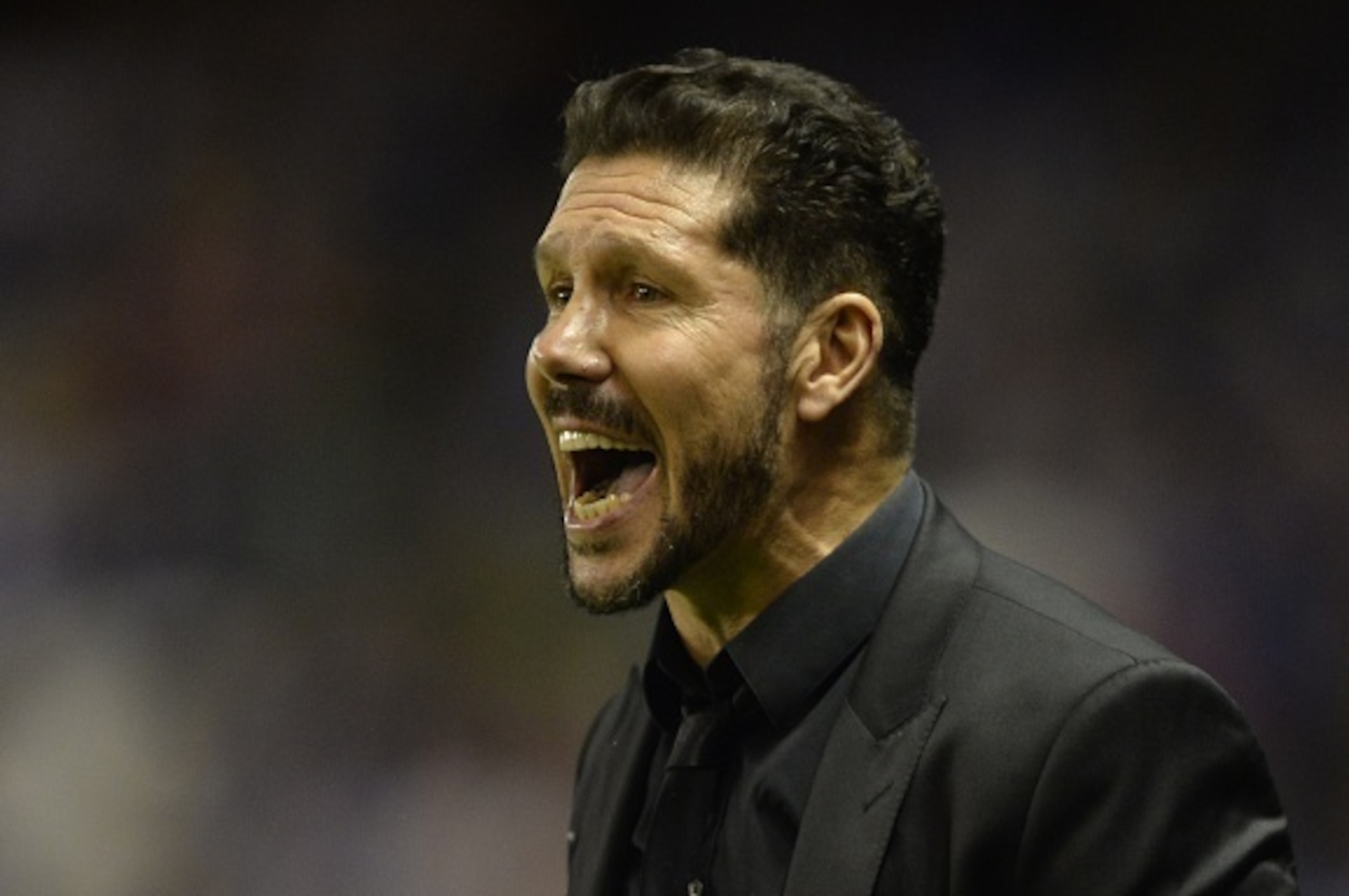 Atletico Madrid's Argentinian coach Diego Simeone shouts during the Spanish league football match RC Deportivo La Coruna vs Club Atletico de Madrid at the Municipal de Riazor stadium in La Coruna on October 30, 2015.  AFP PHOTO / MIGUEL RIOPA        (Phot