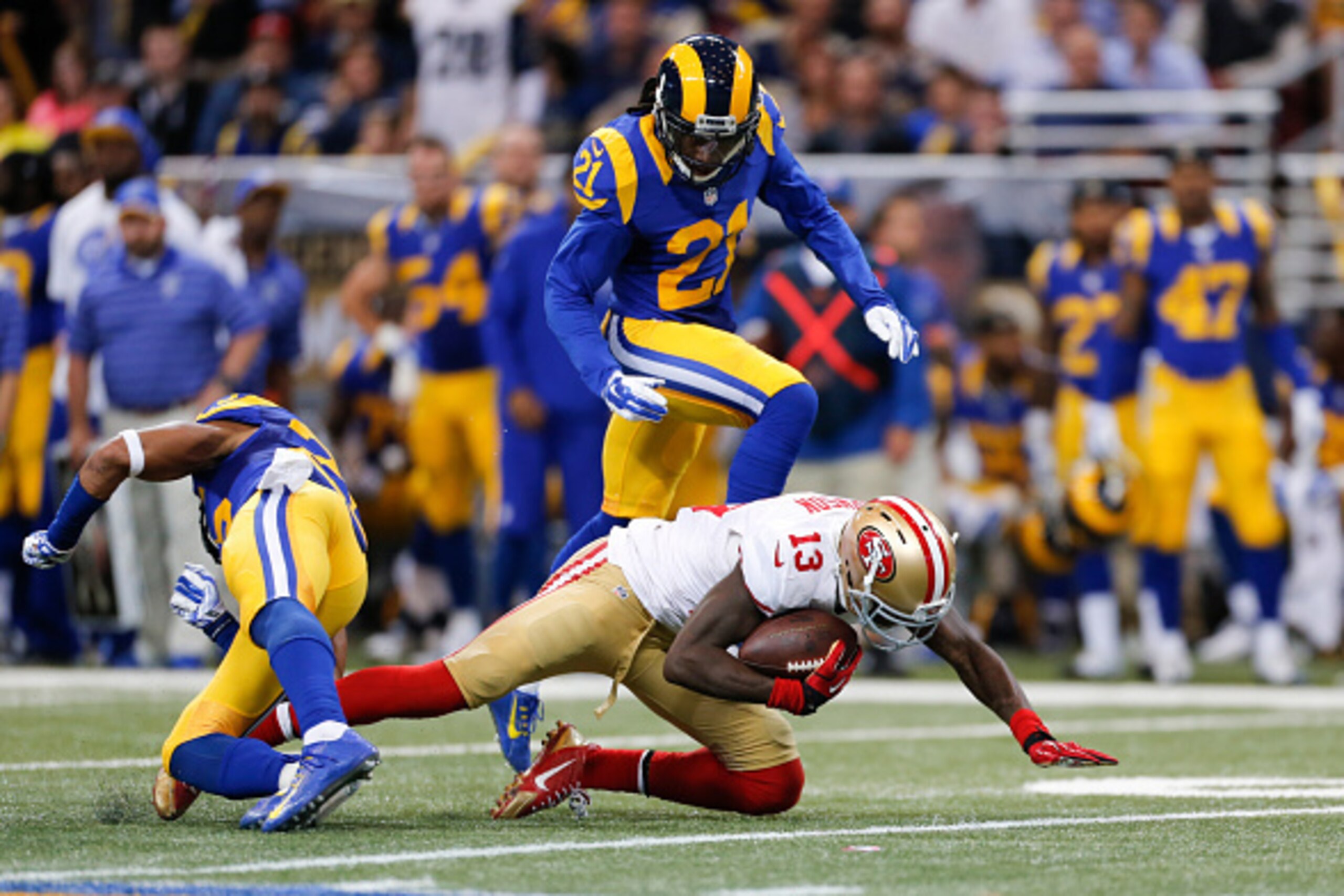 ST. LOUIS, MO - OCTOBER 13: Stevie Johnson #13 of the San Francisco 49ers makes a reception as Janoris Jenkins #21 of the St. Louis Rams defends during the game at the Edward Jones Dome on October 13, 2014 in St. Louis, Missouri. The 49ers defeated the Ra ST. LOUIS, MO - OCTOBER 13: Stevie Johnson #13 of the San Francisco 49ers makes a reception as Janoris Jenkins #21 of the St. Louis Rams defends during the game at the Edward Jones Dome on October 13, 2014 in St. Louis, Missouri. The 49ers defeated the Ra