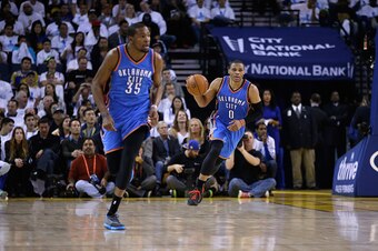 OAKLAND, CA - JANUARY 05:  Russell Westbrook #0 and Kevin Durant #35 of the Oklahoma City Thunder in action against the Golden State Warriors at ORACLE Arena on January 5, 2015 in Oakland, California.  NOTE TO USER: User expressly acknowledges and agrees 