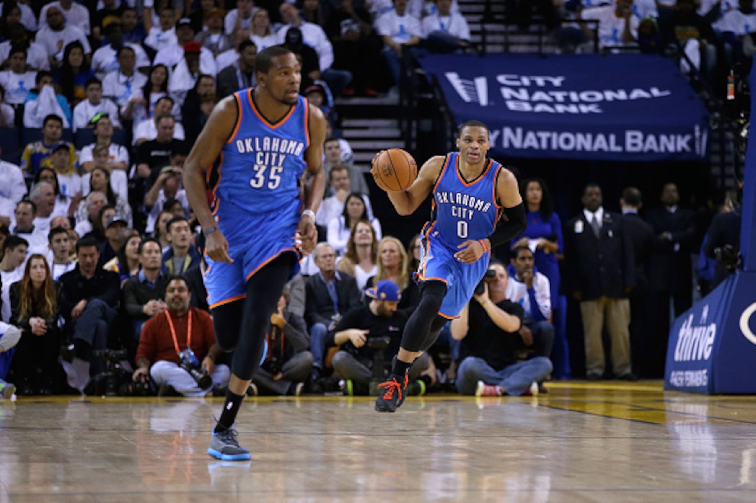 OAKLAND, CA - JANUARY 05:  Russell Westbrook #0 and Kevin Durant #35 of the Oklahoma City Thunder in action against the Golden State Warriors at ORACLE Arena on January 5, 2015 in Oakland, California.  NOTE TO USER: User expressly acknowledges and agrees 