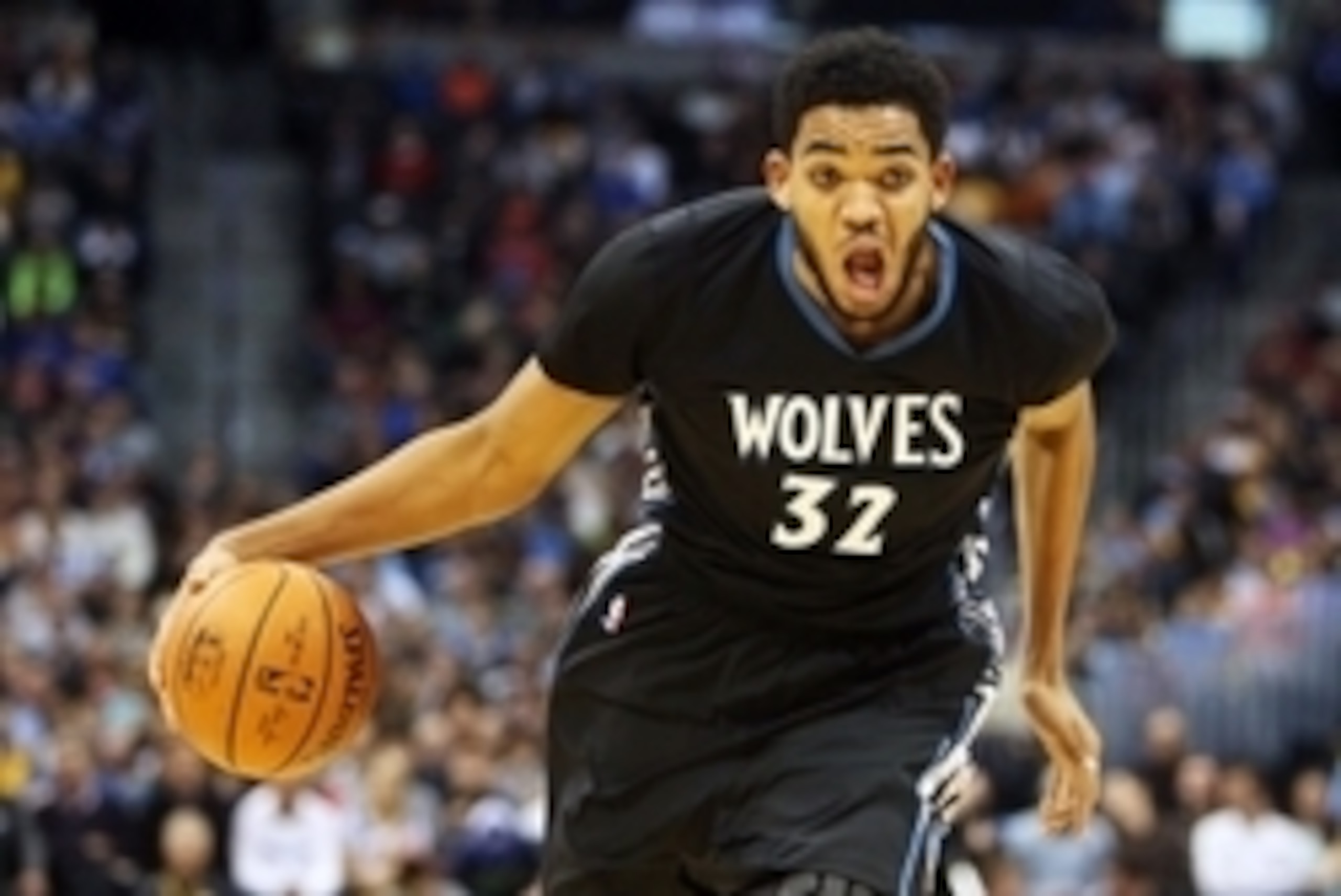 Oct 30, 2015; Denver, CO, USA; Minnesota Timberwolves center Karl-Anthony Towns (32) drives to the basket during the first half against the Denver Nuggets at Pepsi Center. Mandatory Credit: Chris Humphreys-USA TODAY Sports