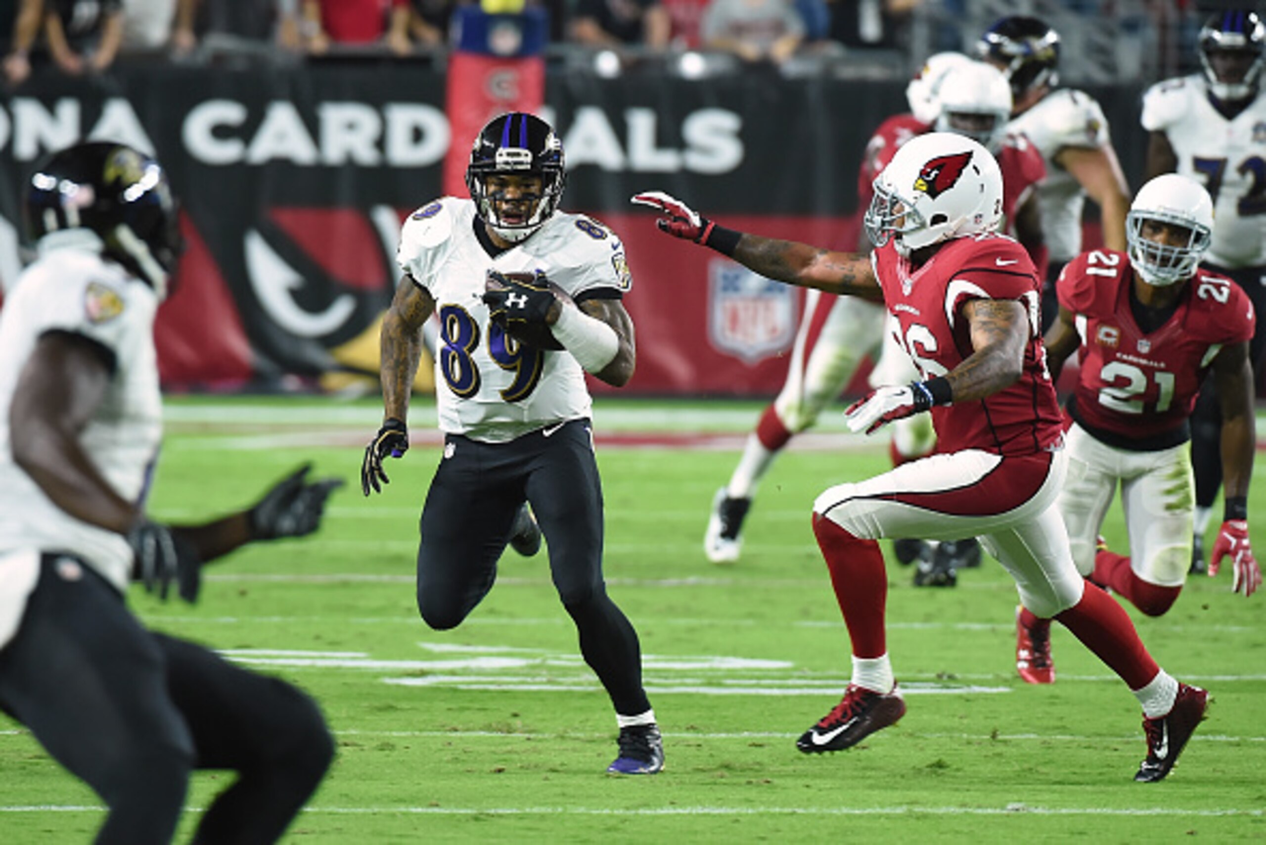 GLENDALE, AZ - OCTOBER 26: Wide receiver Steve Smith Sr. #89 of the Baltimore Ravens rushes the football against free safety Rashad Johnson #26 of the Arizona Cardinals in the first half of the NFL game at University of Phoenix Stadium on October 26, 2015