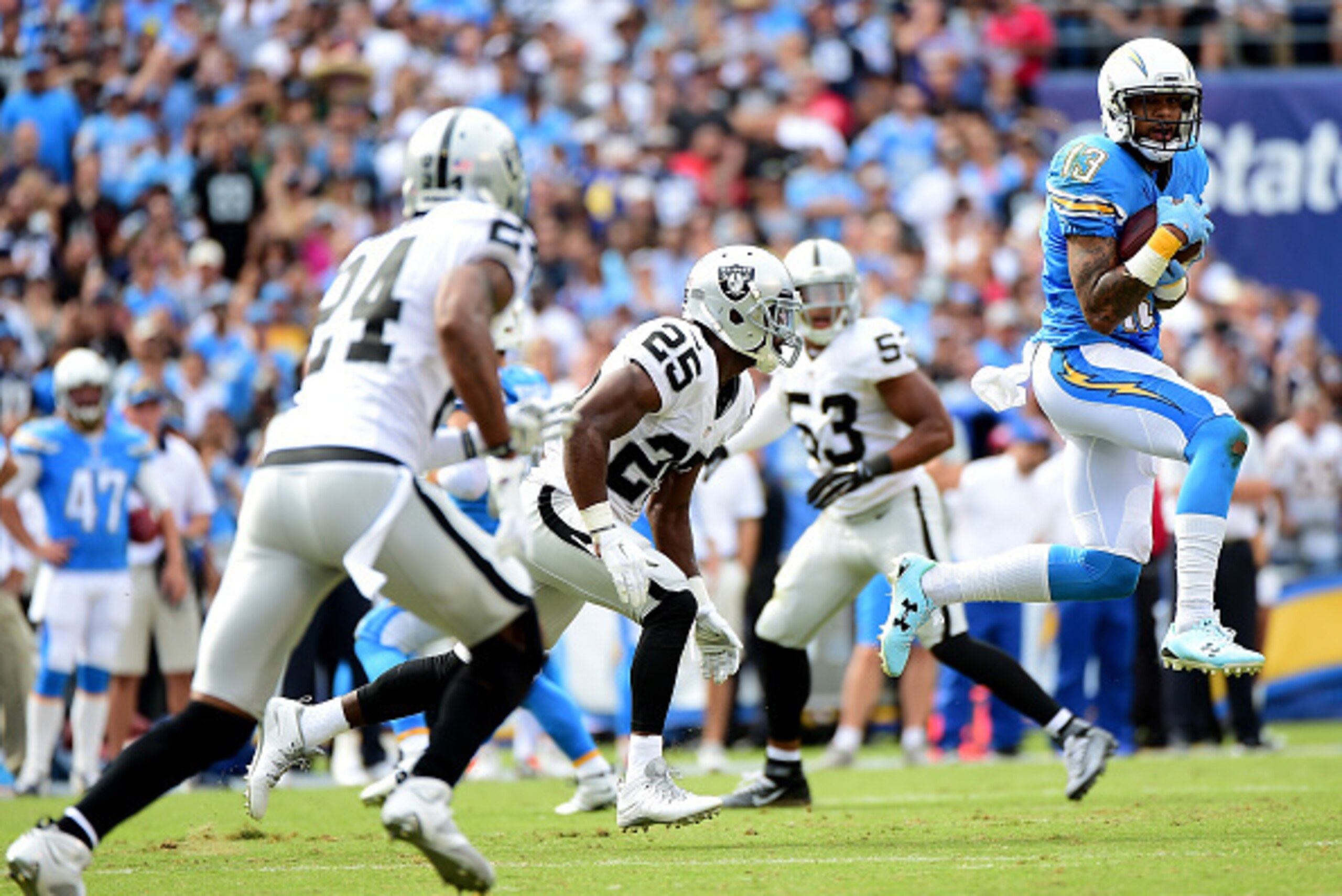 SAN DIEGO, CA - OCTOBER 25:   Keenan Allen #13 of the San Diego Chargers makes a catch for a first down past  D.J. Hayden #25 of the Oakland Raiders during the first quarter at Qualcomm Stadium on October 25, 2015 in San Diego, California.  (Photo by Harr