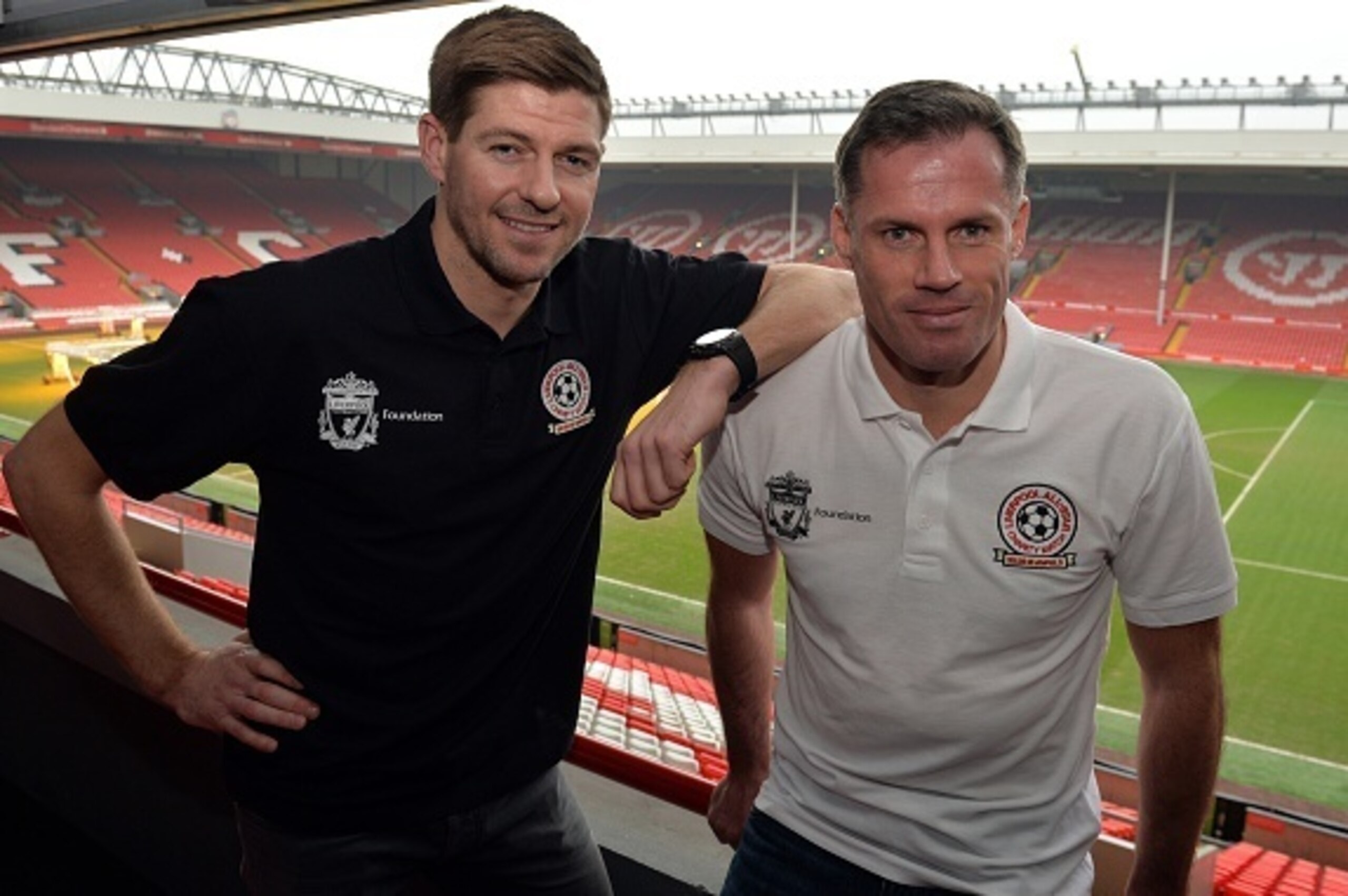 Liverpool's English captain and midfielder Steven Gerrard (L) and former Liverpool team mate Jamie Carragher attend a press conference at Anfield in Liverpool, north west England on March 12, 2015 ahead of an All-Star charity match at the stadium on March