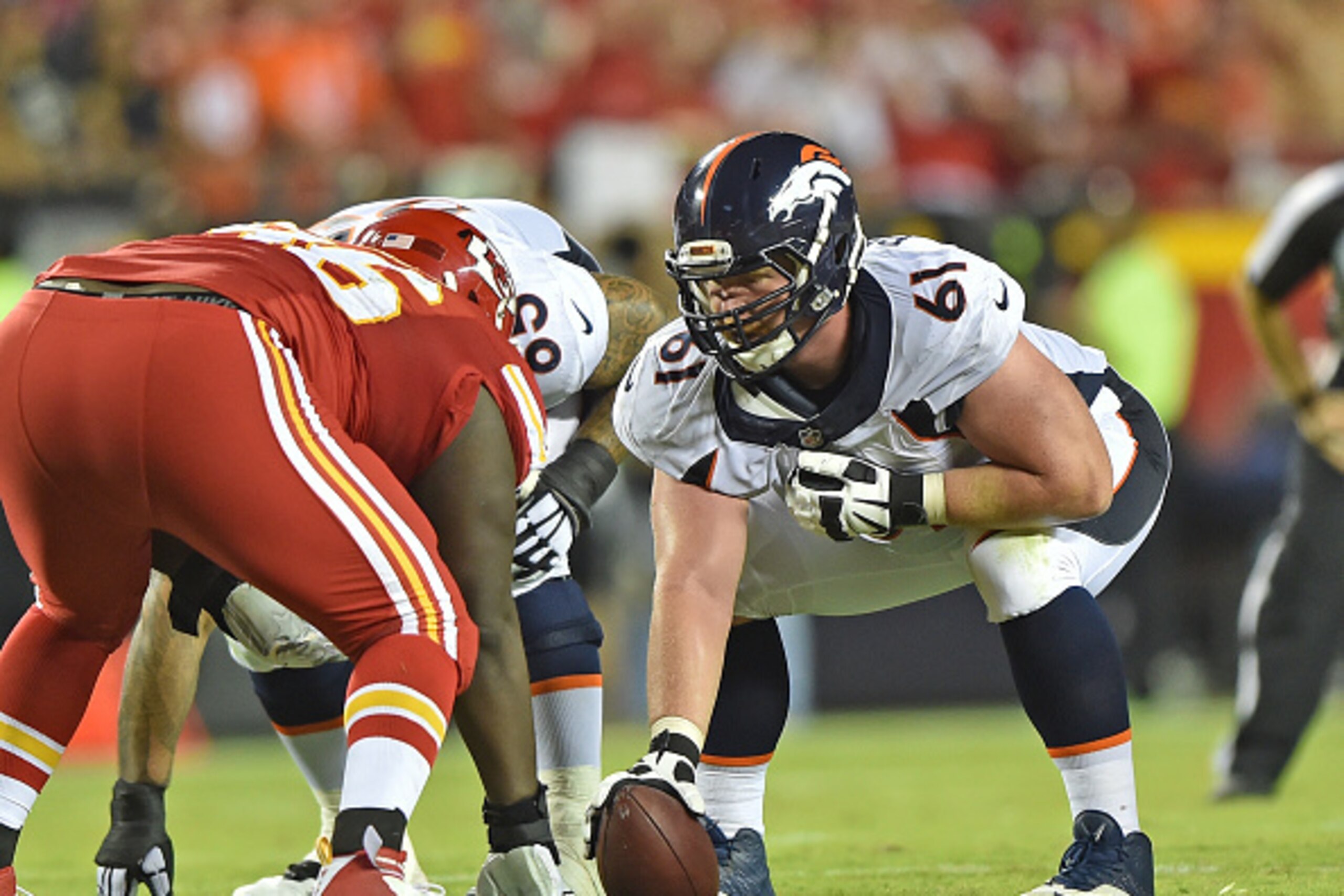 KANSAS CITY, MO - SEPTEMBER 17:  Center Matt Paradis #61 of the Denver Broncos gets ready to snap the ball against the Kansas City Chiefs during the first half at Arrowhead Stadium on September 17, 2015 in Kansas City, Missouri.  (Photo by Peter G. Aiken/