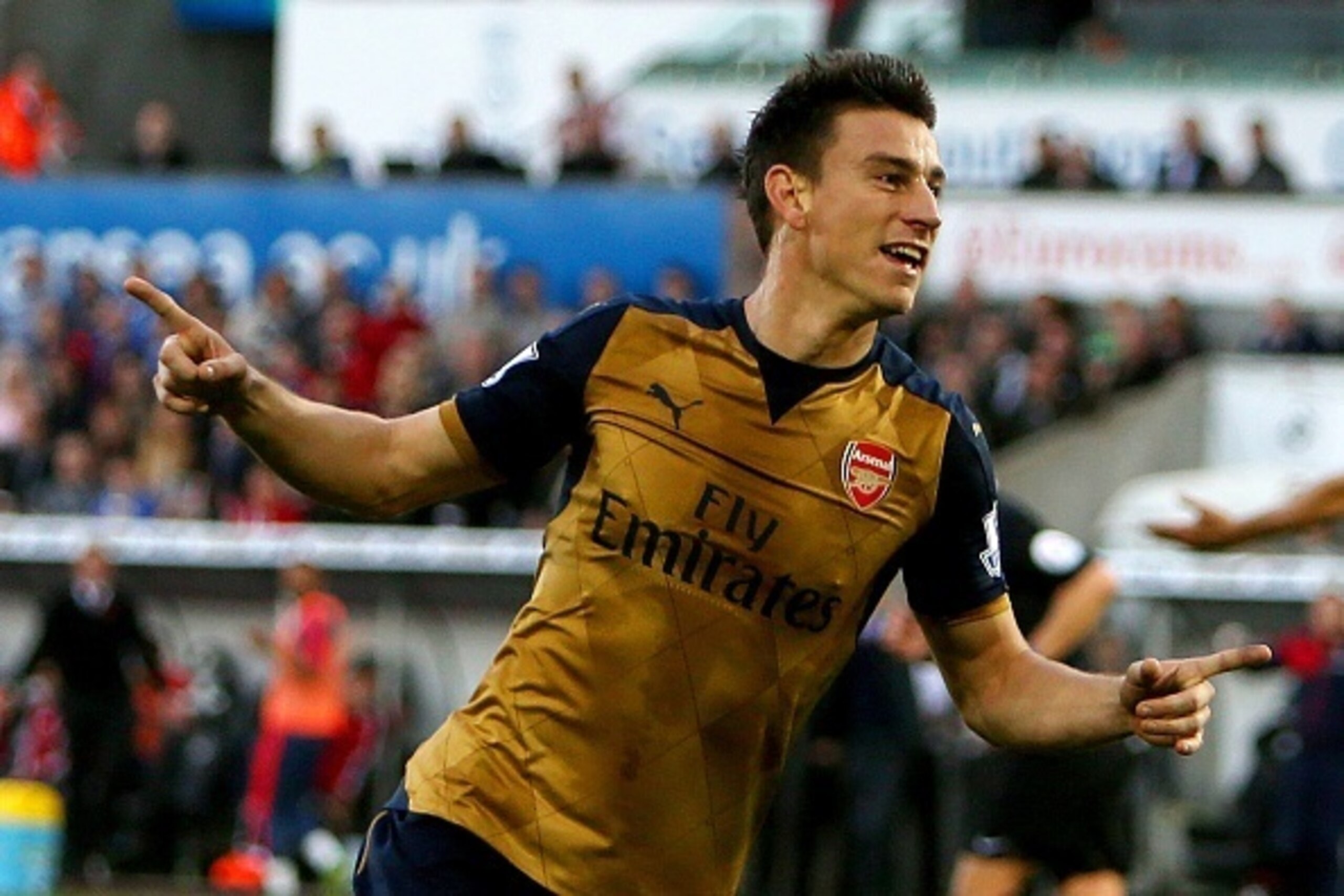 Arsenal's French defender Laurent Koscielny celebrates after scoring their second goal during the English Premier League football match between Swansea City and Arsenal at The Liberty Stadium in Swansea, south Wales on October 31, 2015. AFP PHOTO / GEOFF 
