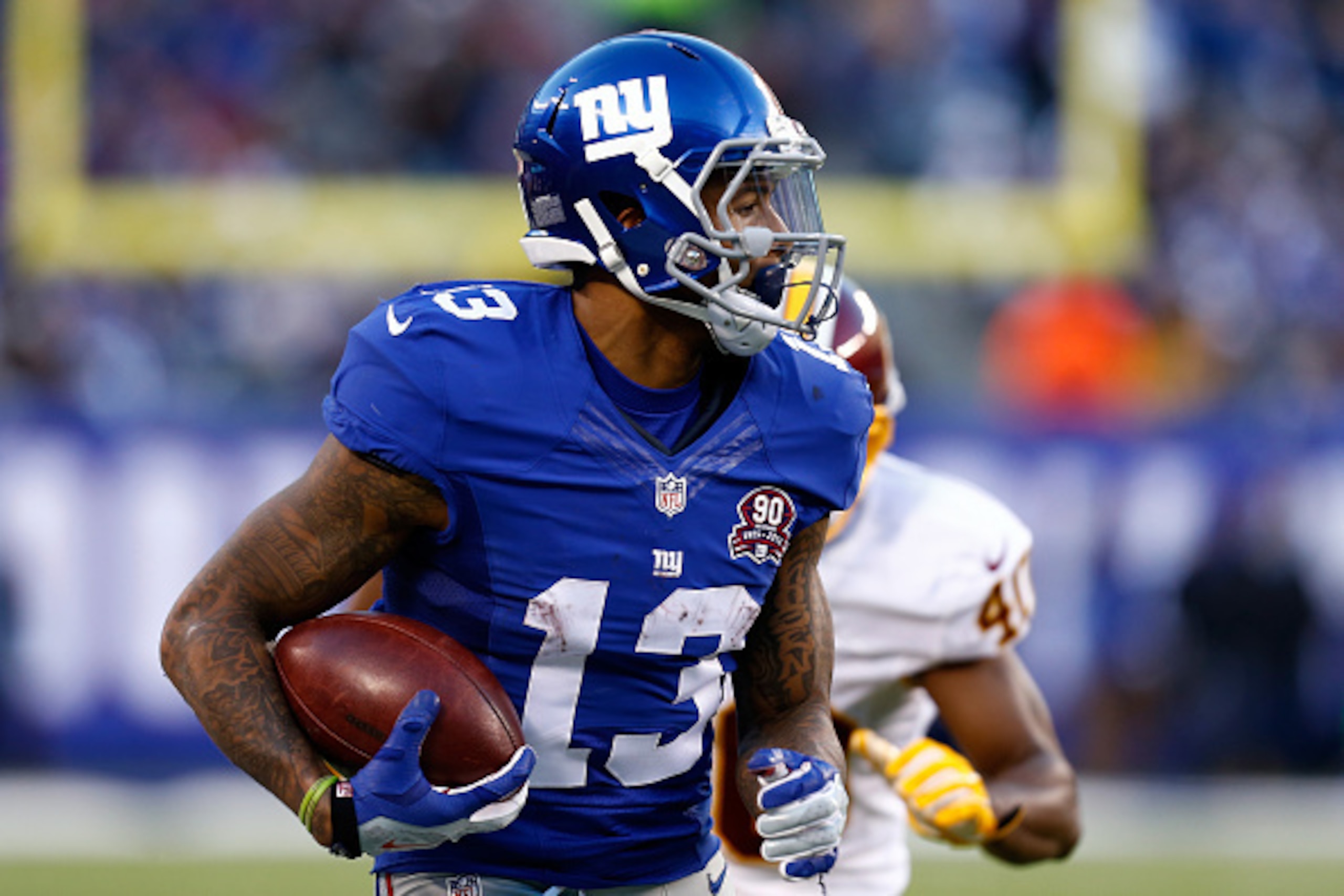 EAST RUTHERFORD, NJ - DECEMBER 14:  Odell Beckham Jr. #13 of the New York Giants runs with the ball against the Washington Redskins during their game at MetLife Stadium on December 14, 2014 in East Rutherford, New Jersey.  (Photo by Jeff Zelevansky/Getty