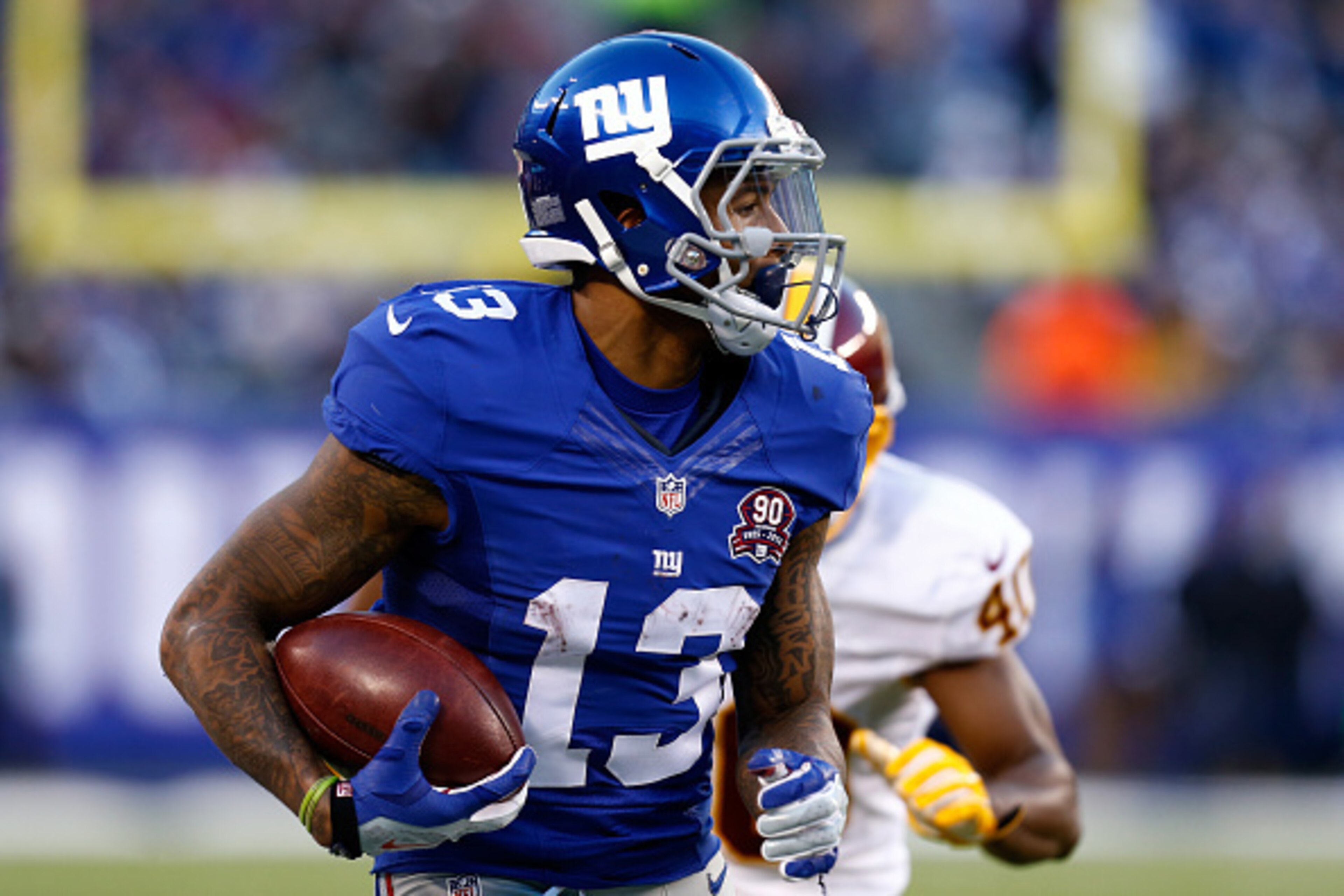 EAST RUTHERFORD, NJ - DECEMBER 14:  Odell Beckham Jr. #13 of the New York Giants runs with the ball against the Washington Redskins during their game at MetLife Stadium on December 14, 2014 in East Rutherford, New Jersey.  (Photo by Jeff Zelevansky/Getty
